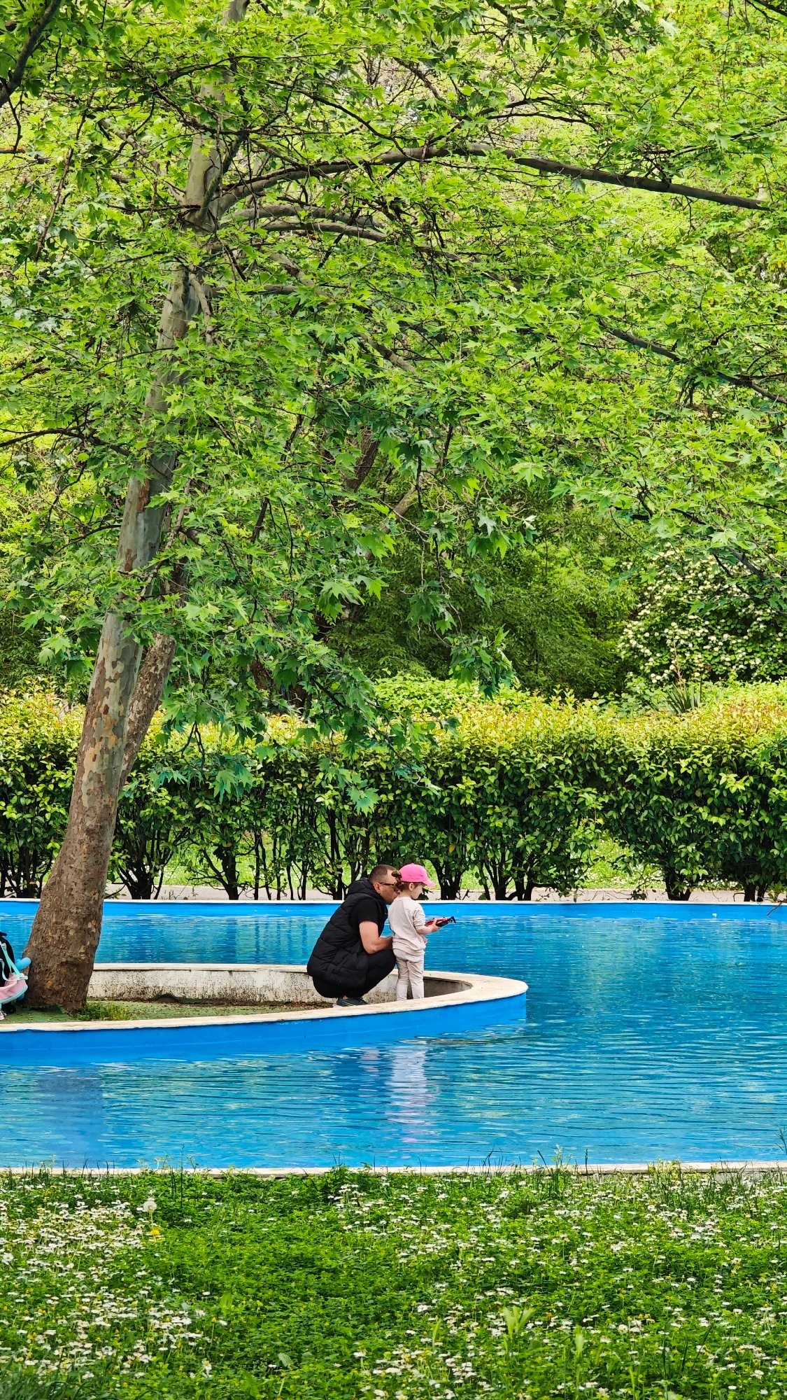 Burgas residents enjoy pool and beach activities on spring afternoon