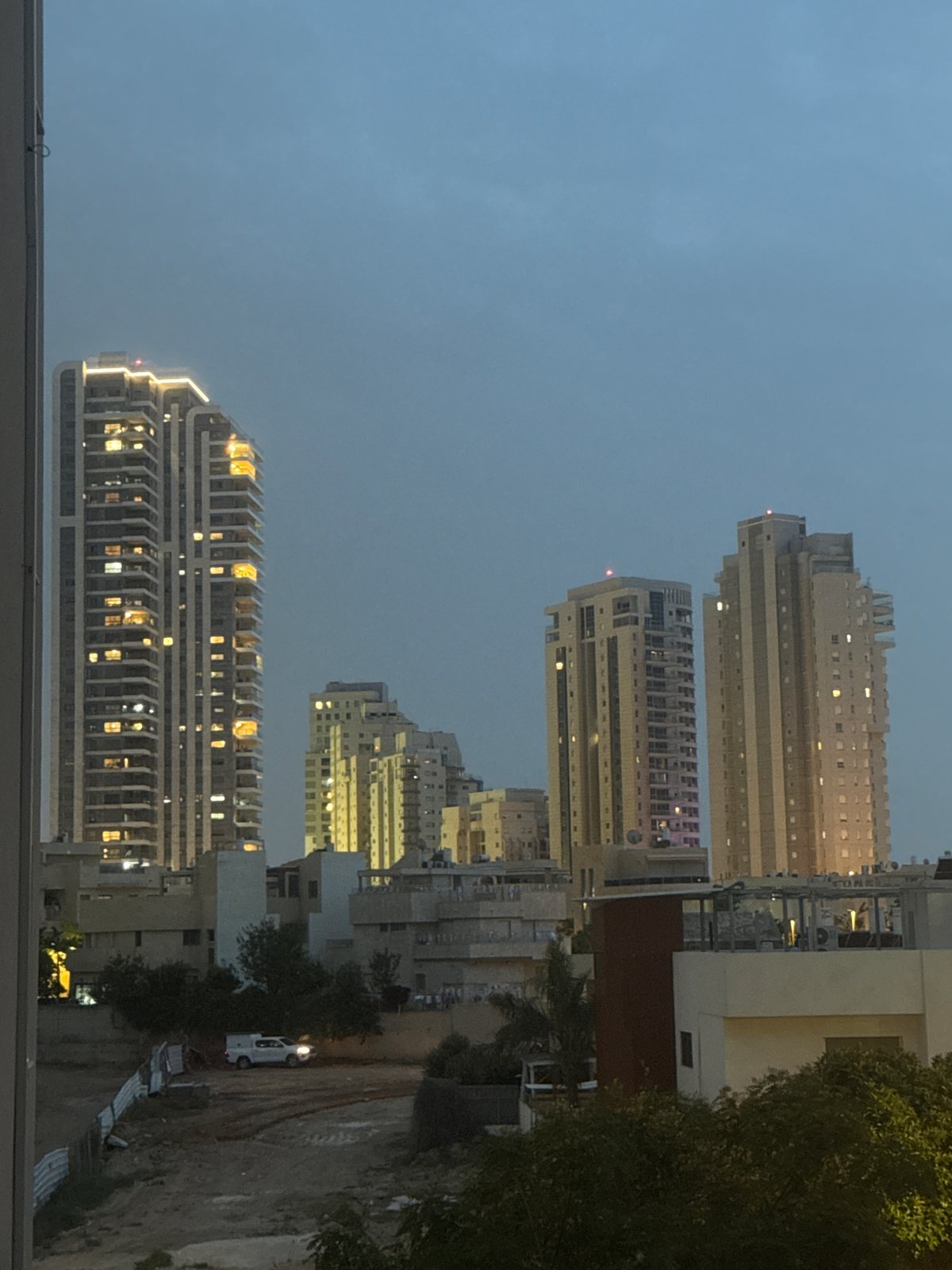 Nighttime cityscape photographed from elevated position in Netanya