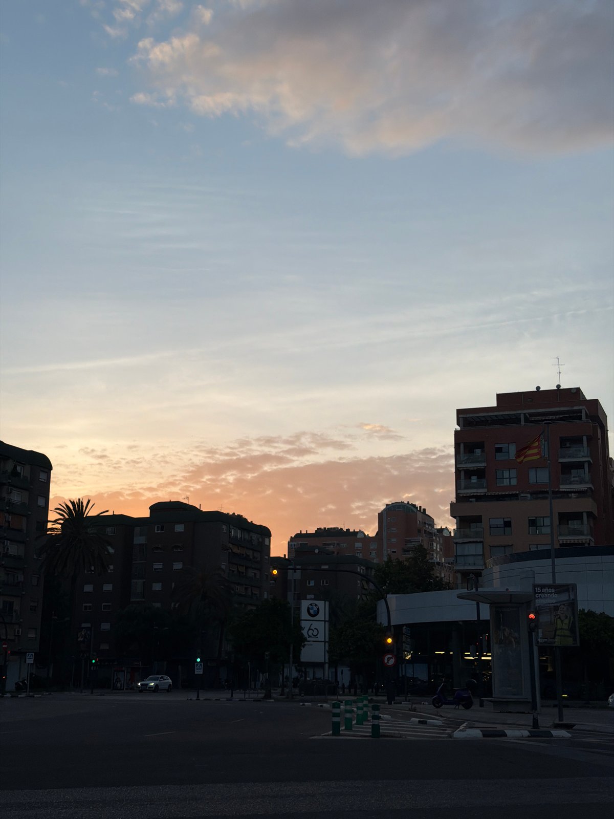 Twilight street scene documented in València during golden hour