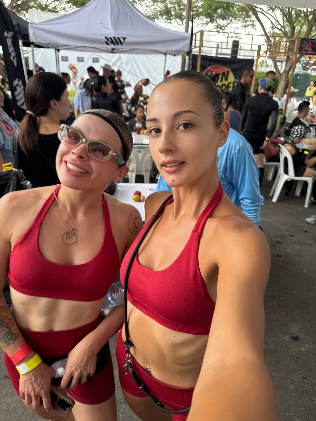 Women in red athletic wear take selfie in Thailand