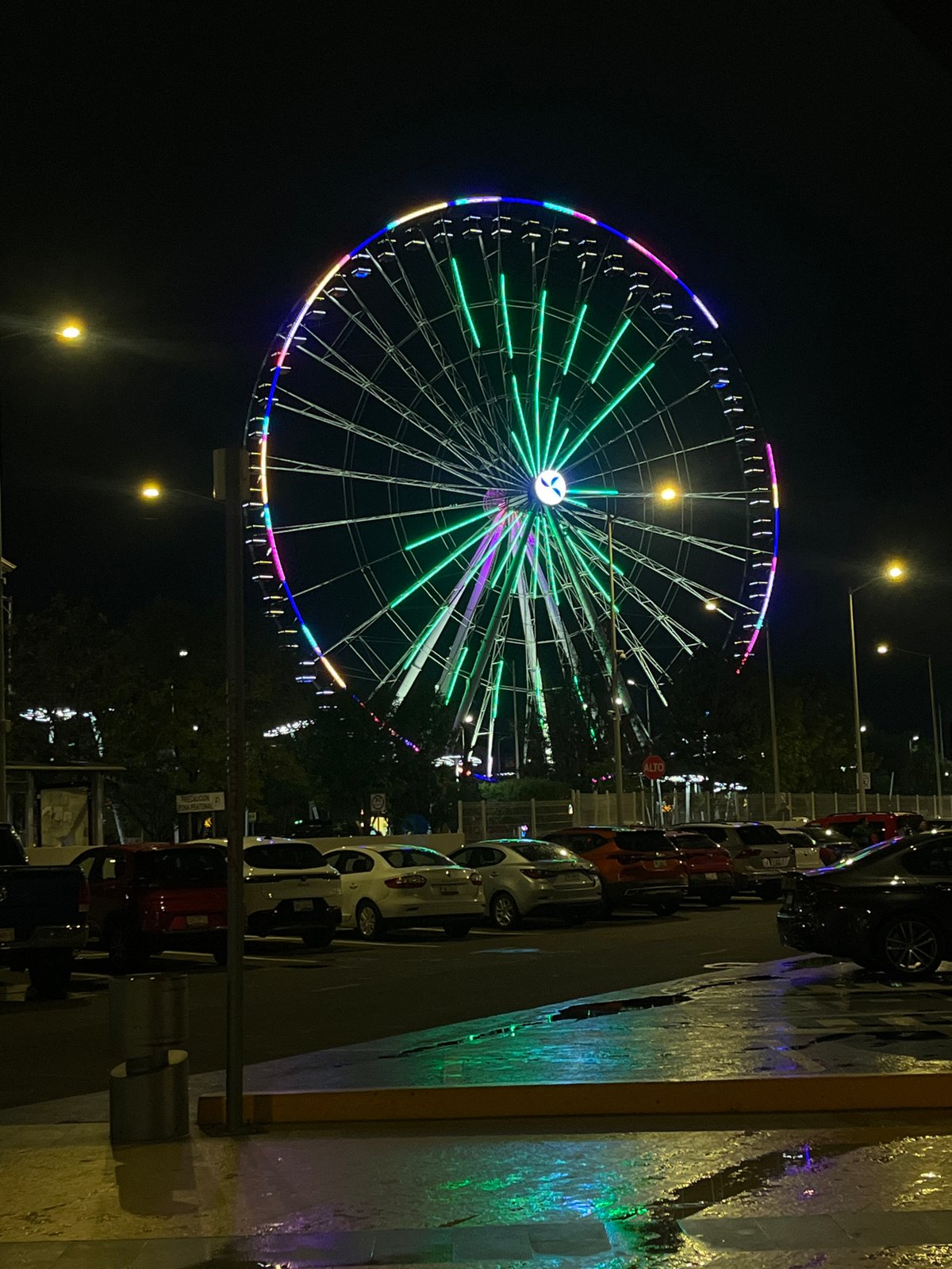 Nighttime carnival and illuminated building captured in late-night documentation