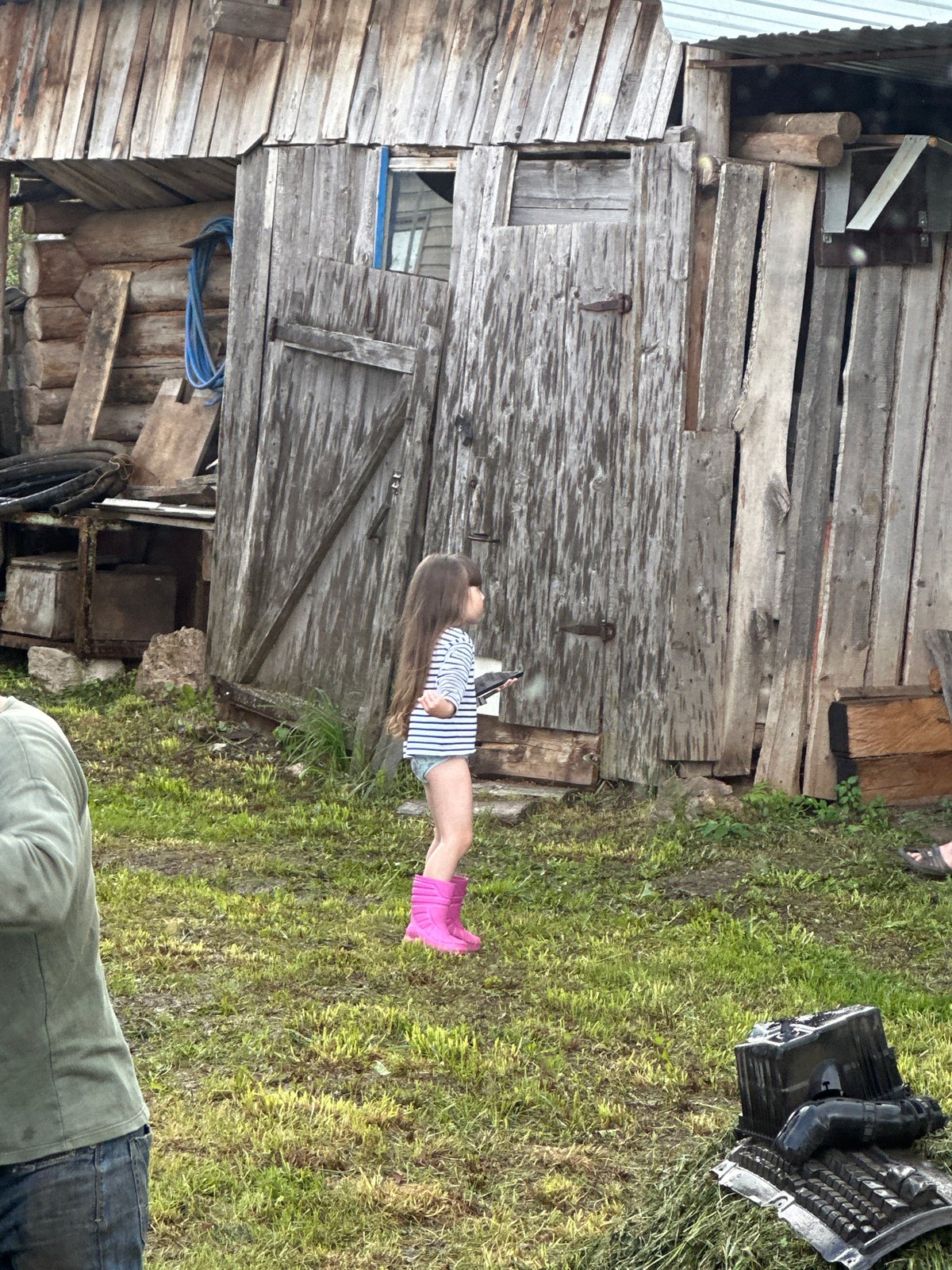 Rural Russian village life during mixed weather afternoon
