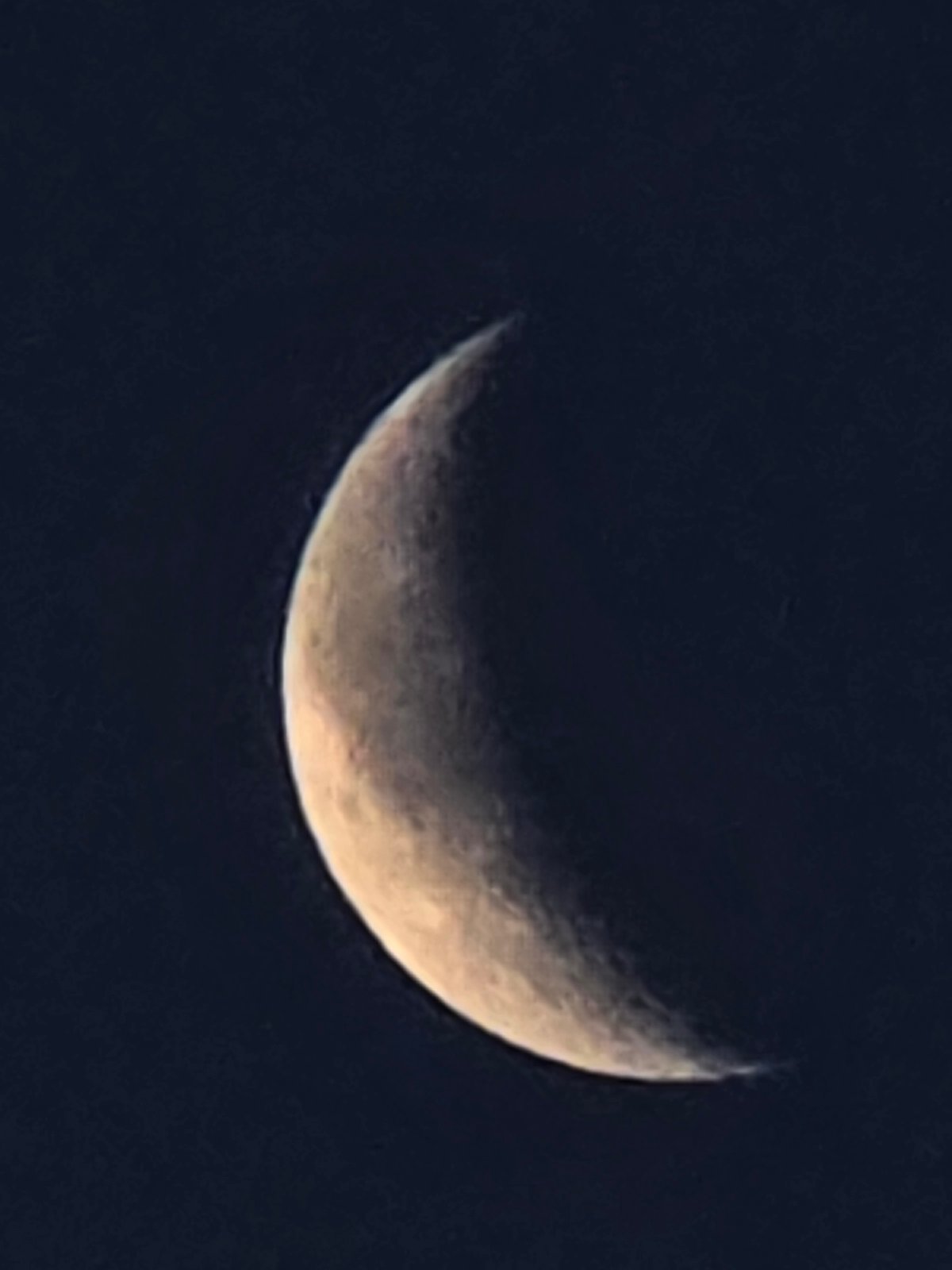 Crescent moon over Yermolayevo, captured across a summer evening
