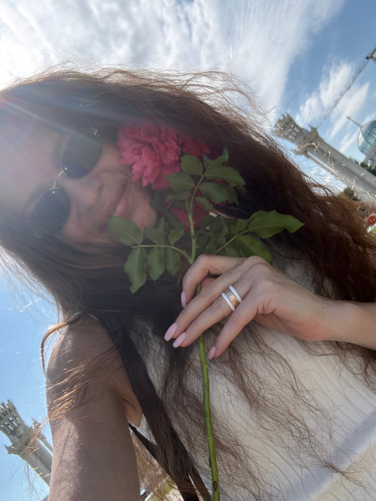 Afternoon at VDNKh, roses and neoclassical pavilions in summer sun