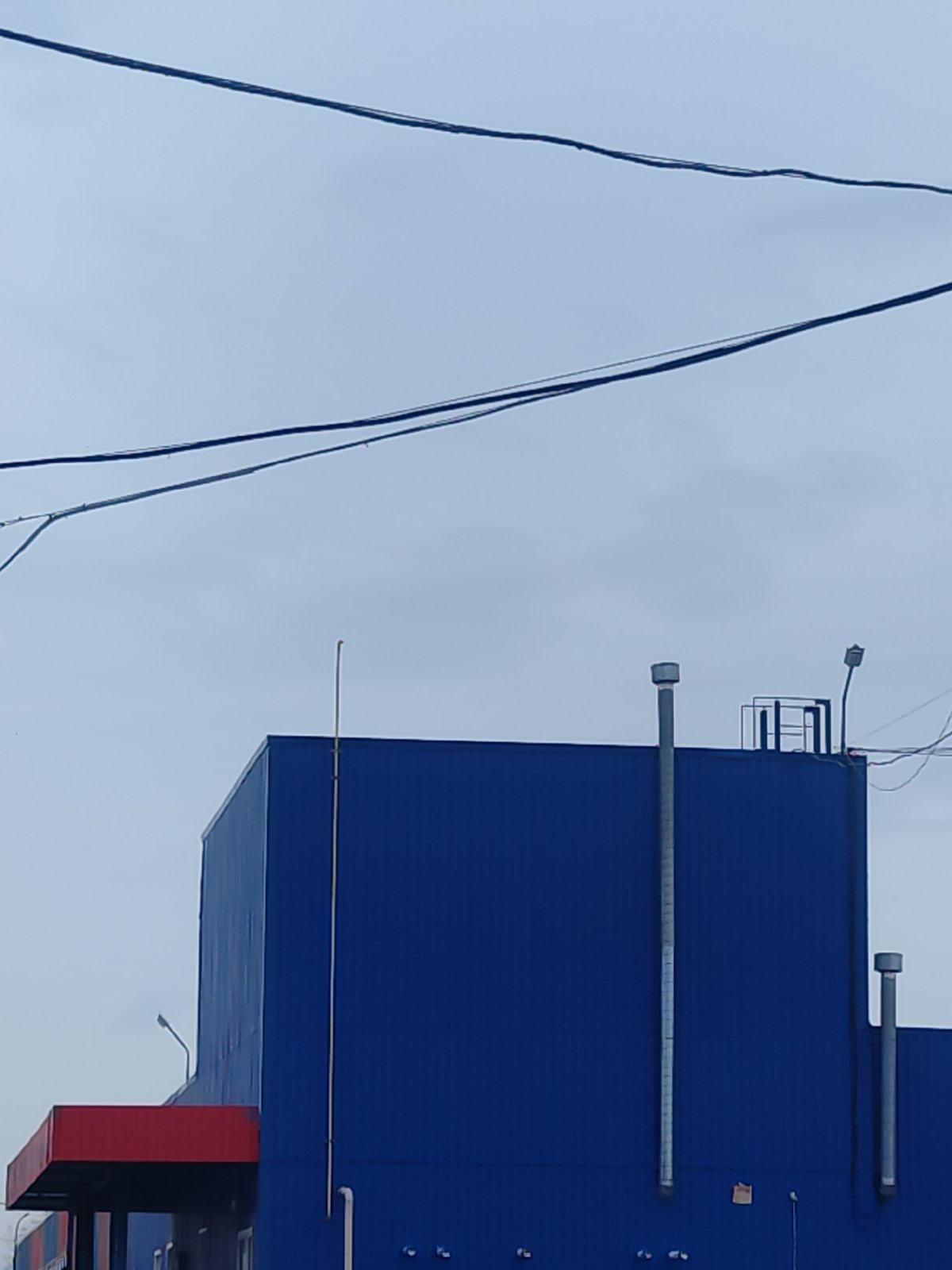 Daily scenes documented in Chaikovsky: industrial building, produce shopping