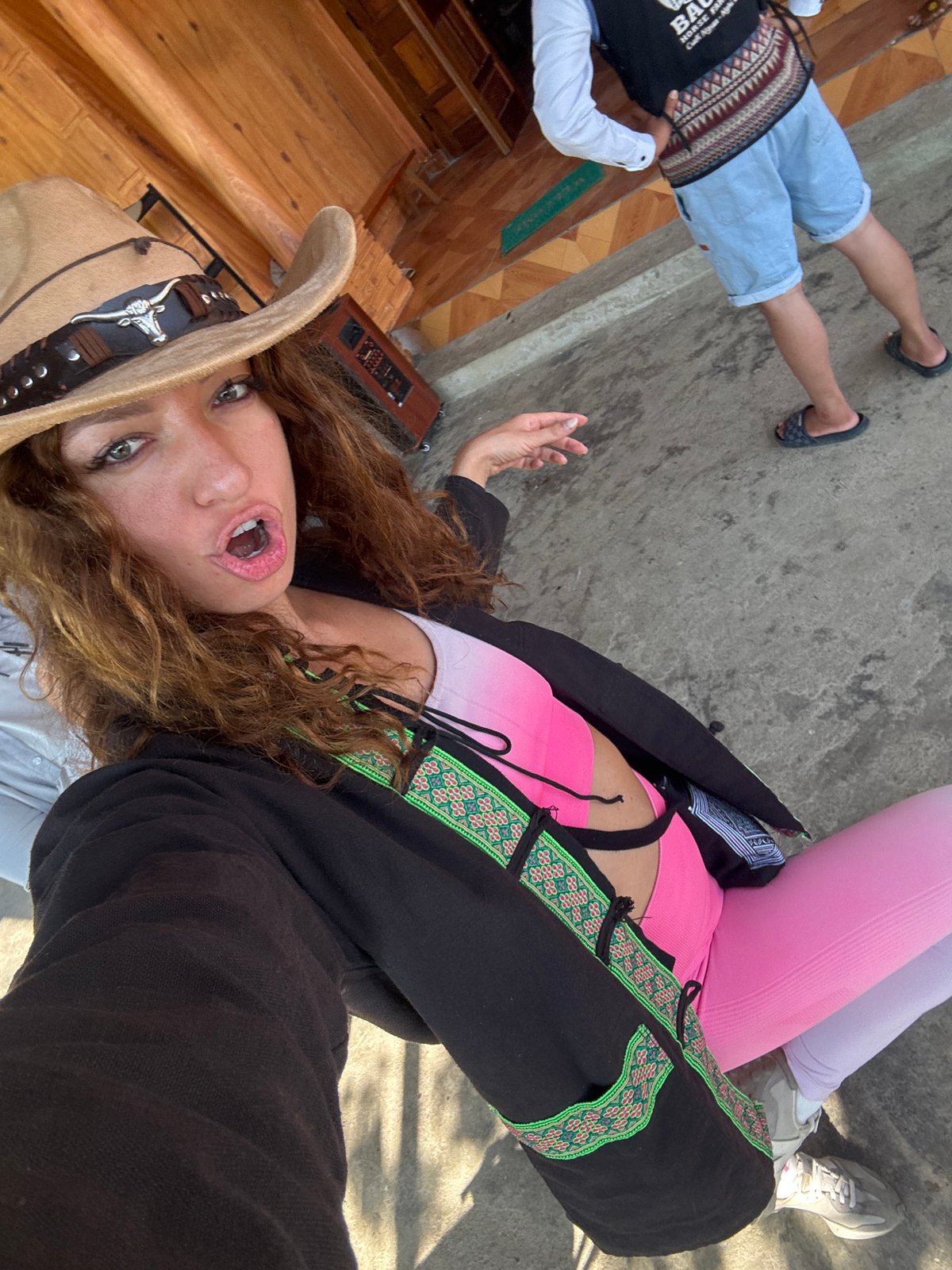 Tourist horseback riding in cowboy hat captured in Bắc Hà