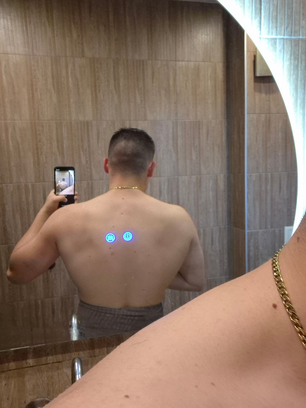 Person takes mirror selfie in Sofia bathroom