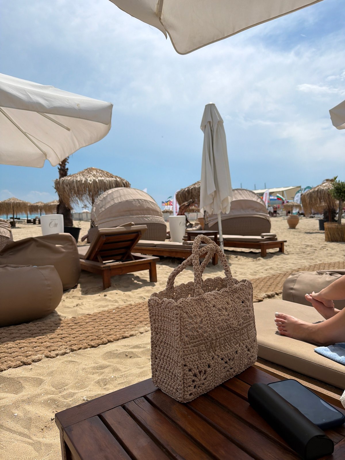 Beach day captured at Bulgarian resort with typical leisure items
