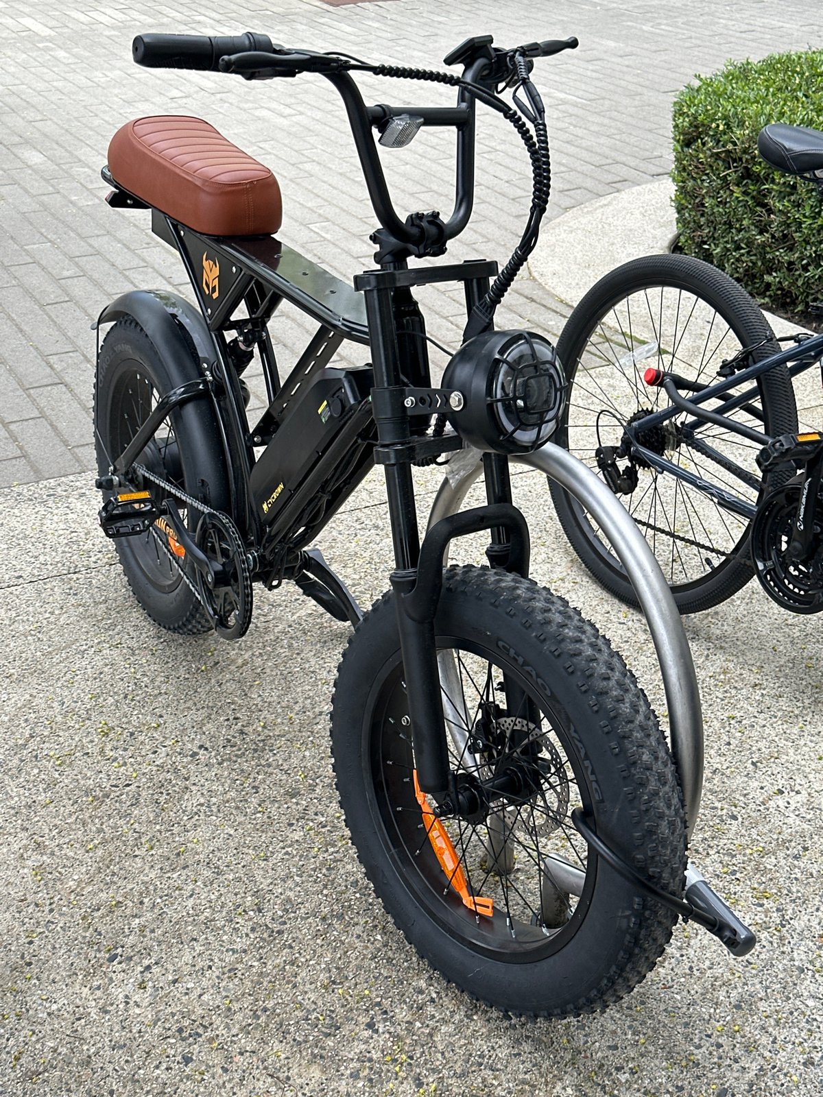 Two bicycles parked on pavement in Burnaby, Canada