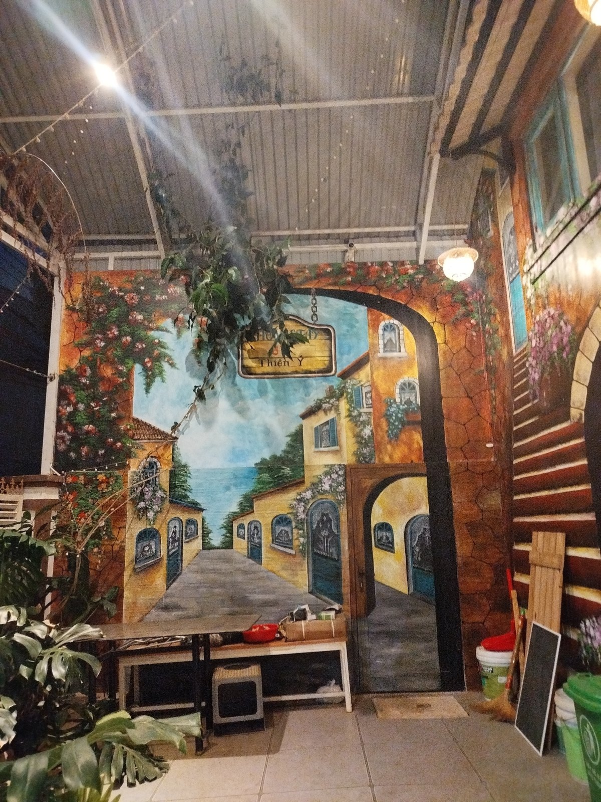 Tourist documents fairy-lit European-themed walkway in Da Lat Vietnam