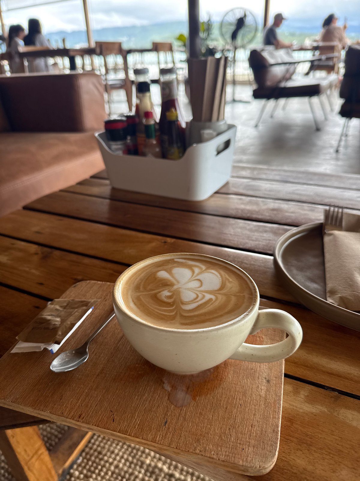 Café breakfast at SEA SUN, Ko Samui, with a Scoot arrival overhead
