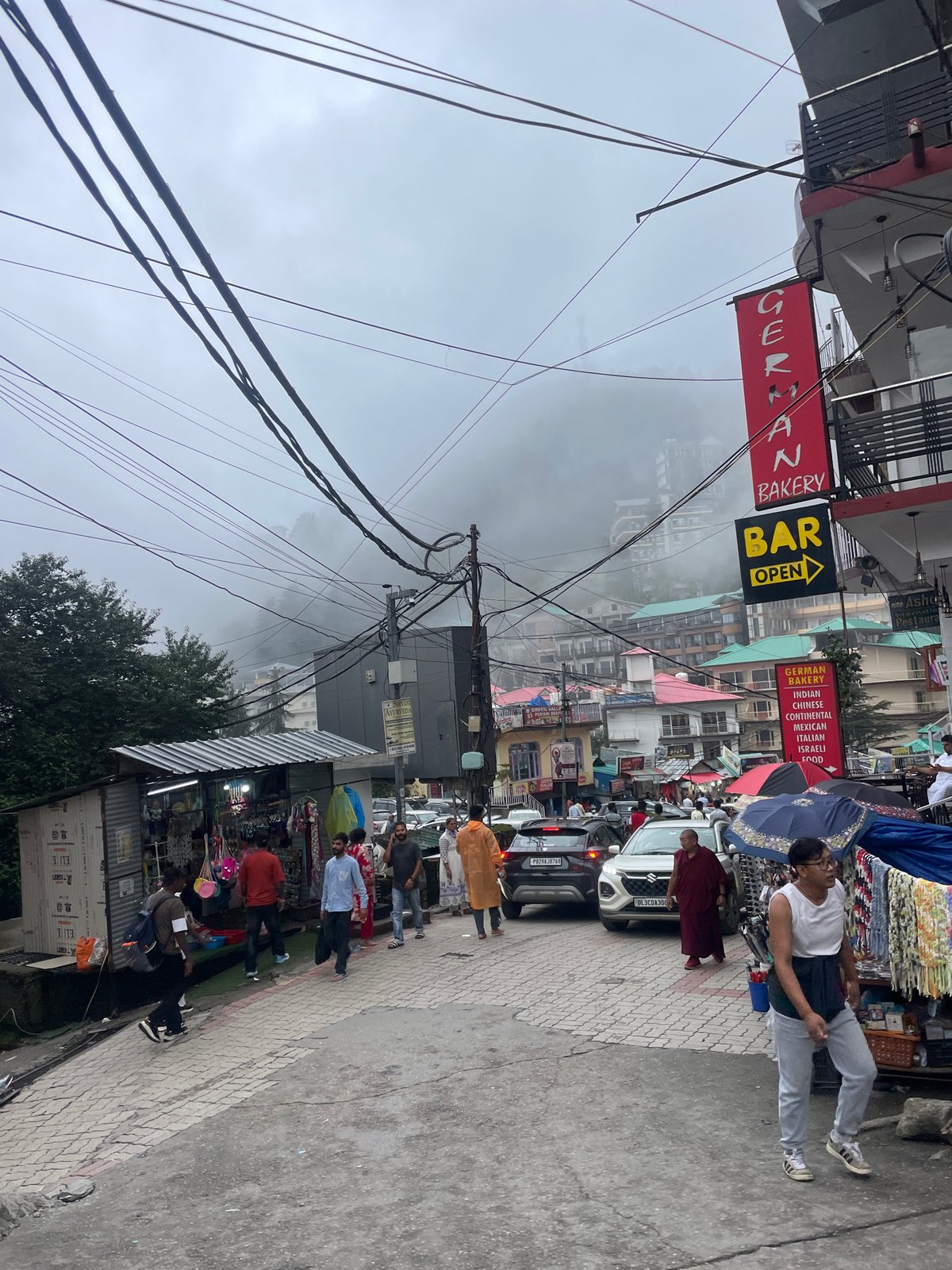 Foggy morning in Bhagsu's rain-soaked streets and hillside markets