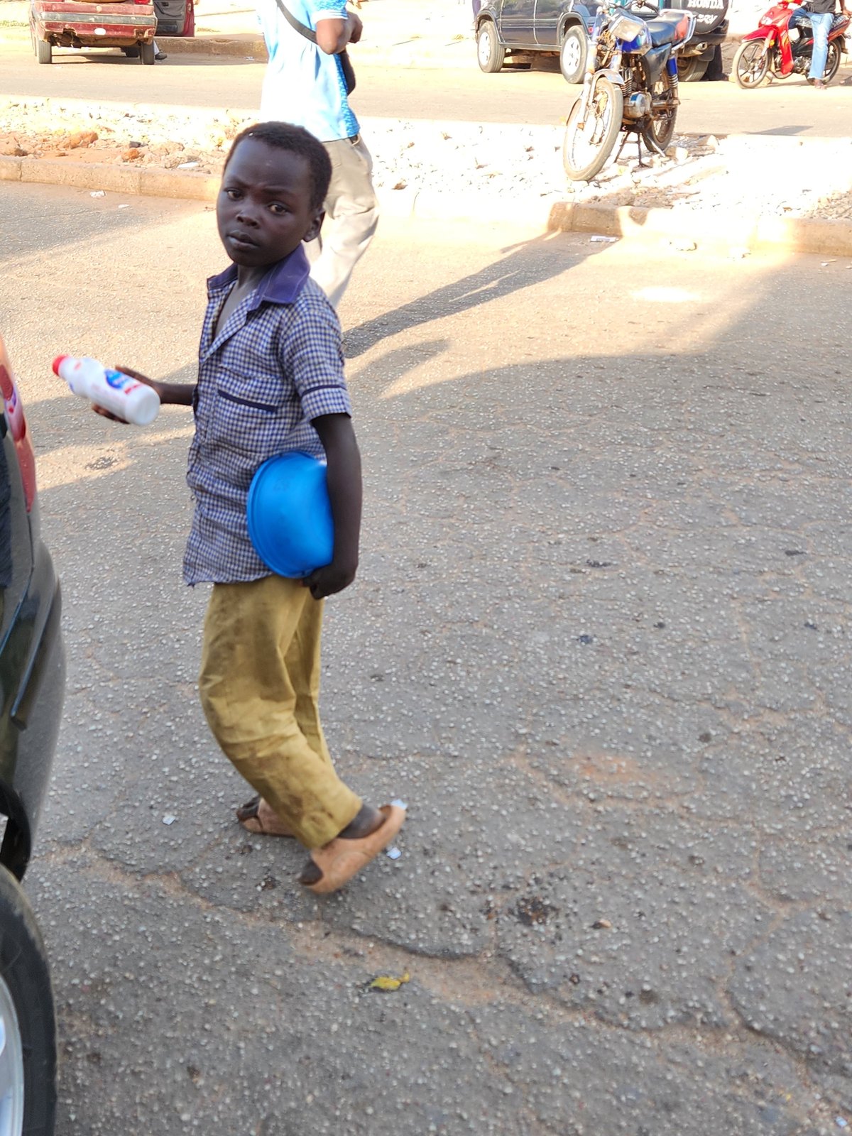 Boy with hard hat spotted on Jos street