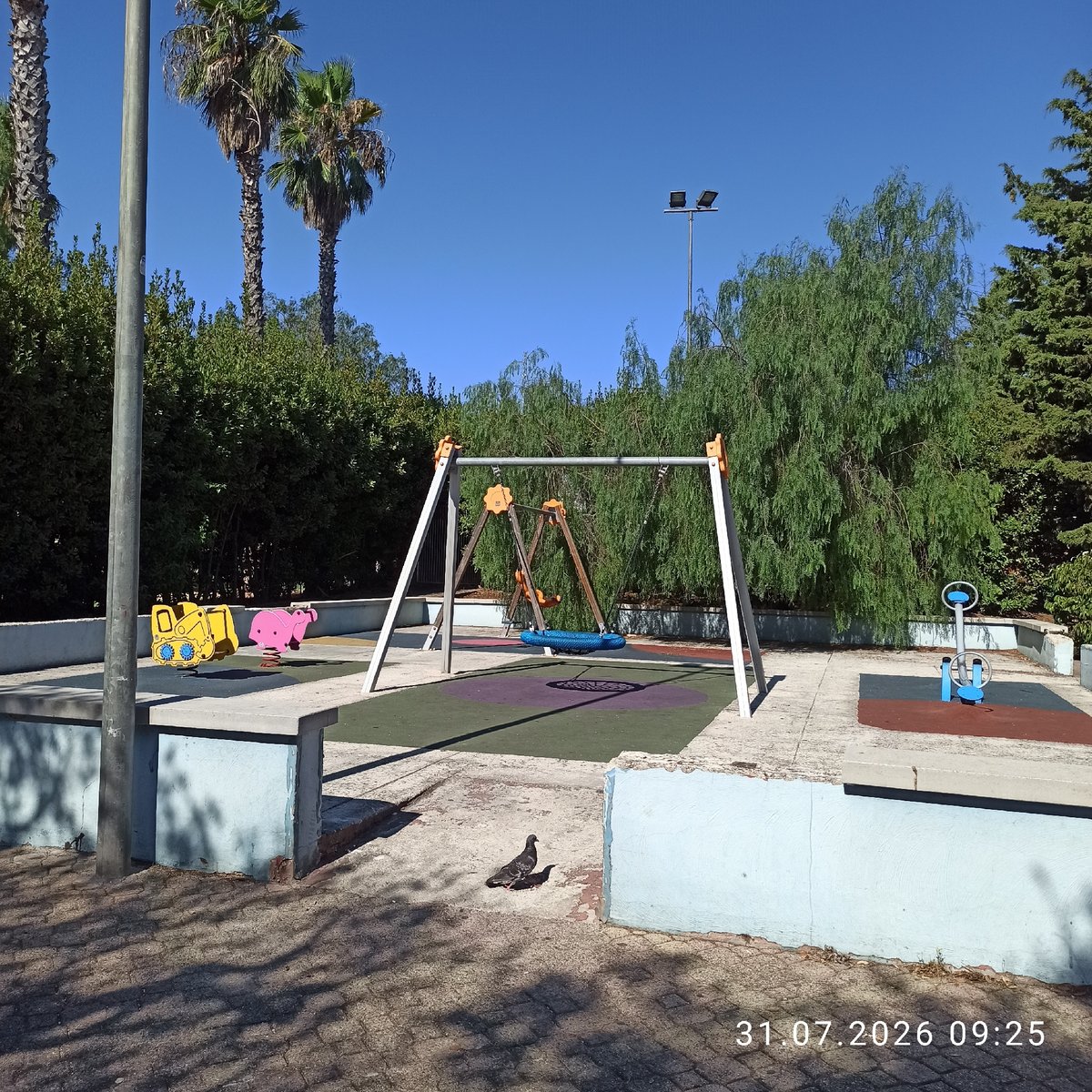 Sunny morning at a Modugno playground and street