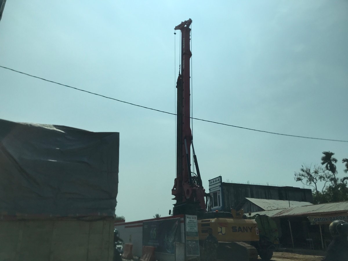 Morning scenes captured across Indonesian towns show construction, vendors