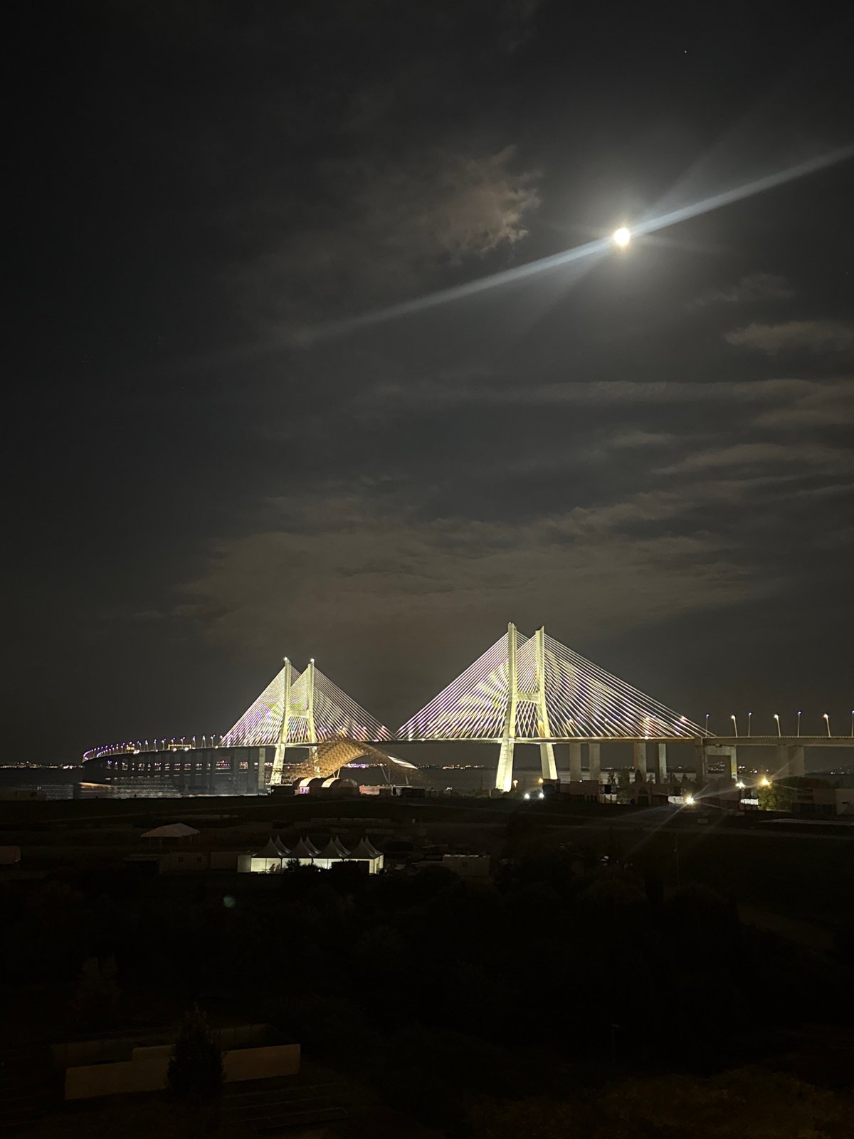 Vasco da Gama Bridge illuminated at night in Loures