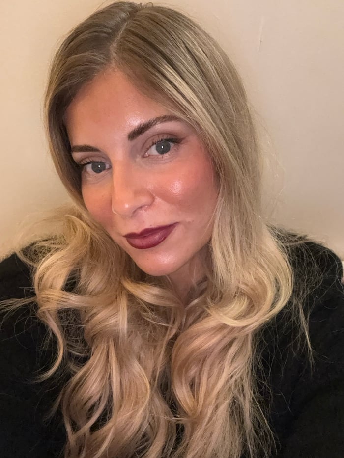Woman documents evening selfie session in Paris residence