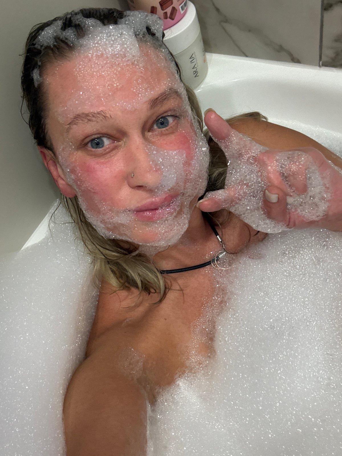 Woman takes bubble bath in Perm, Russia apartment