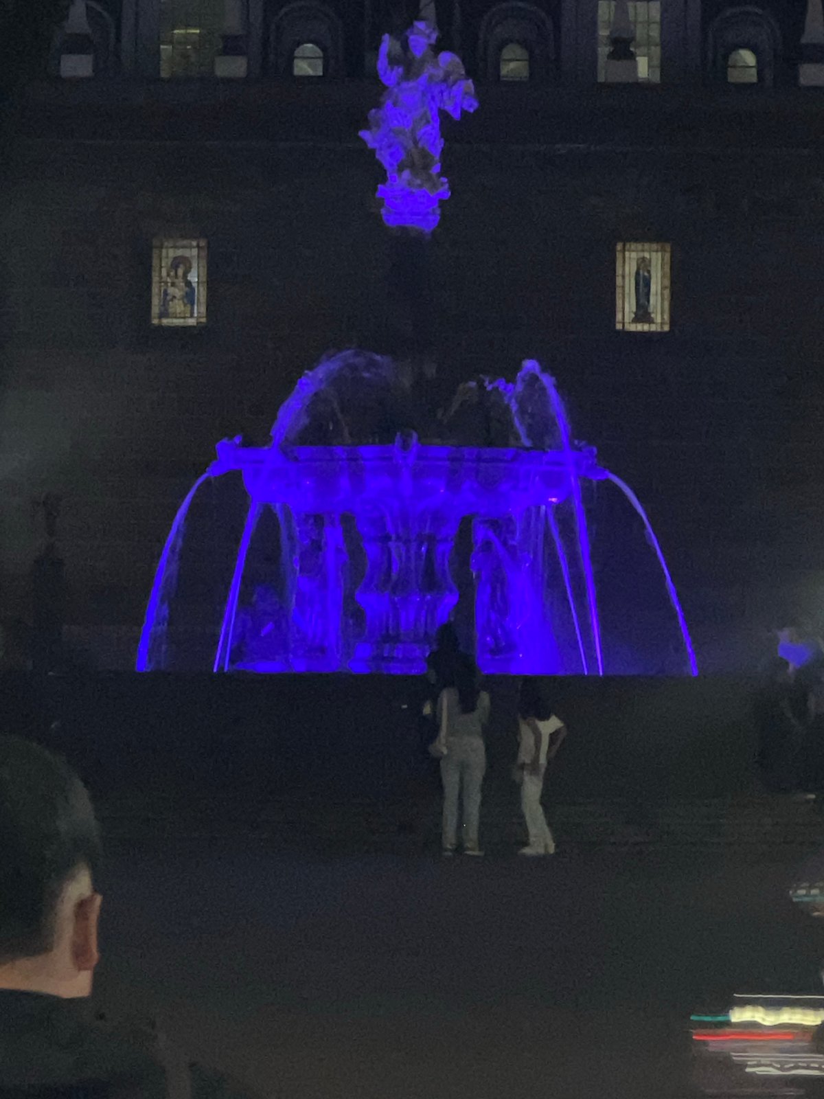 Electric blue art installation illuminated at night