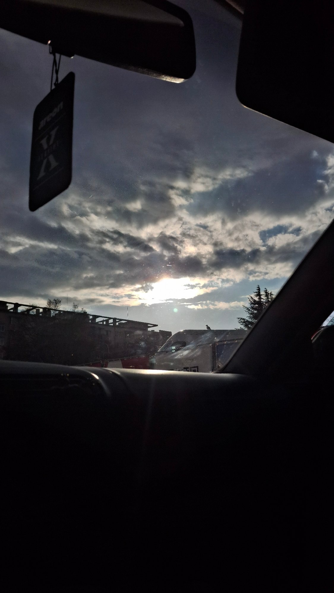 Vehicle occupant observes sky through windshield on April 12