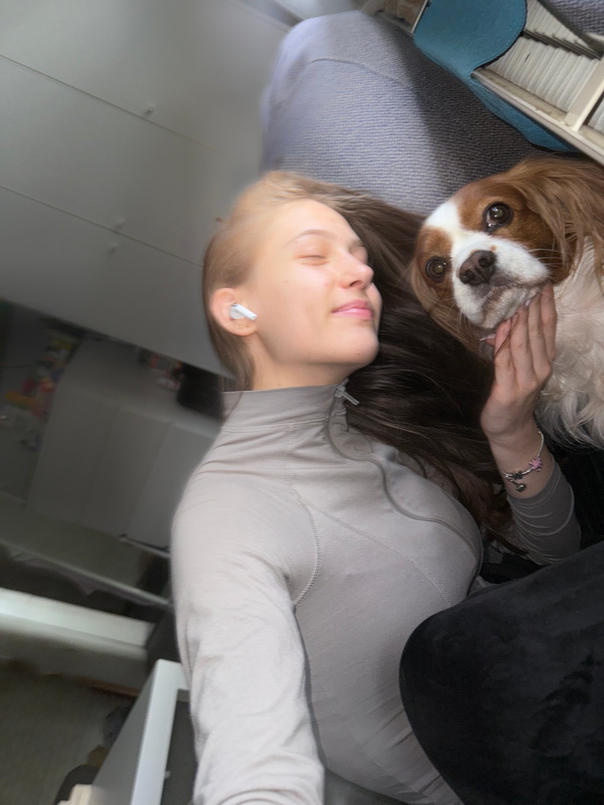 Woman enjoys quiet morning with dog in Sofia home