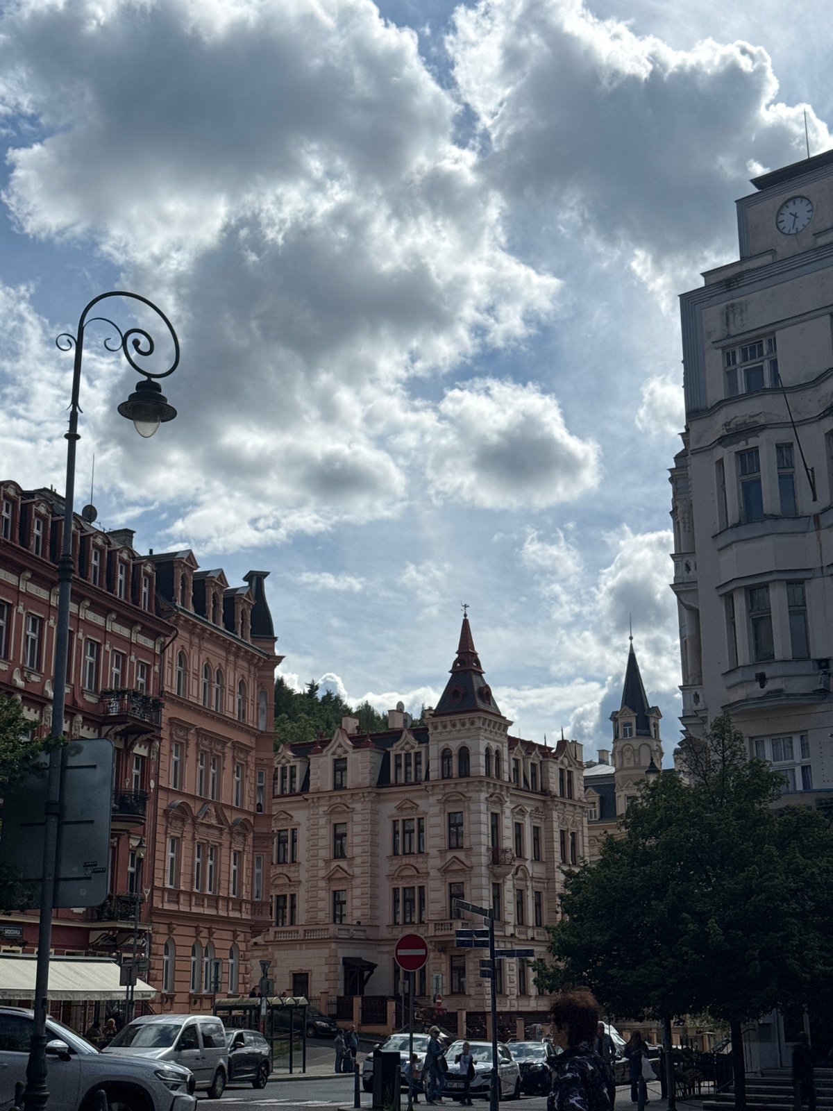Tourist captures historic architecture during afternoon walk in Karlovy Vary