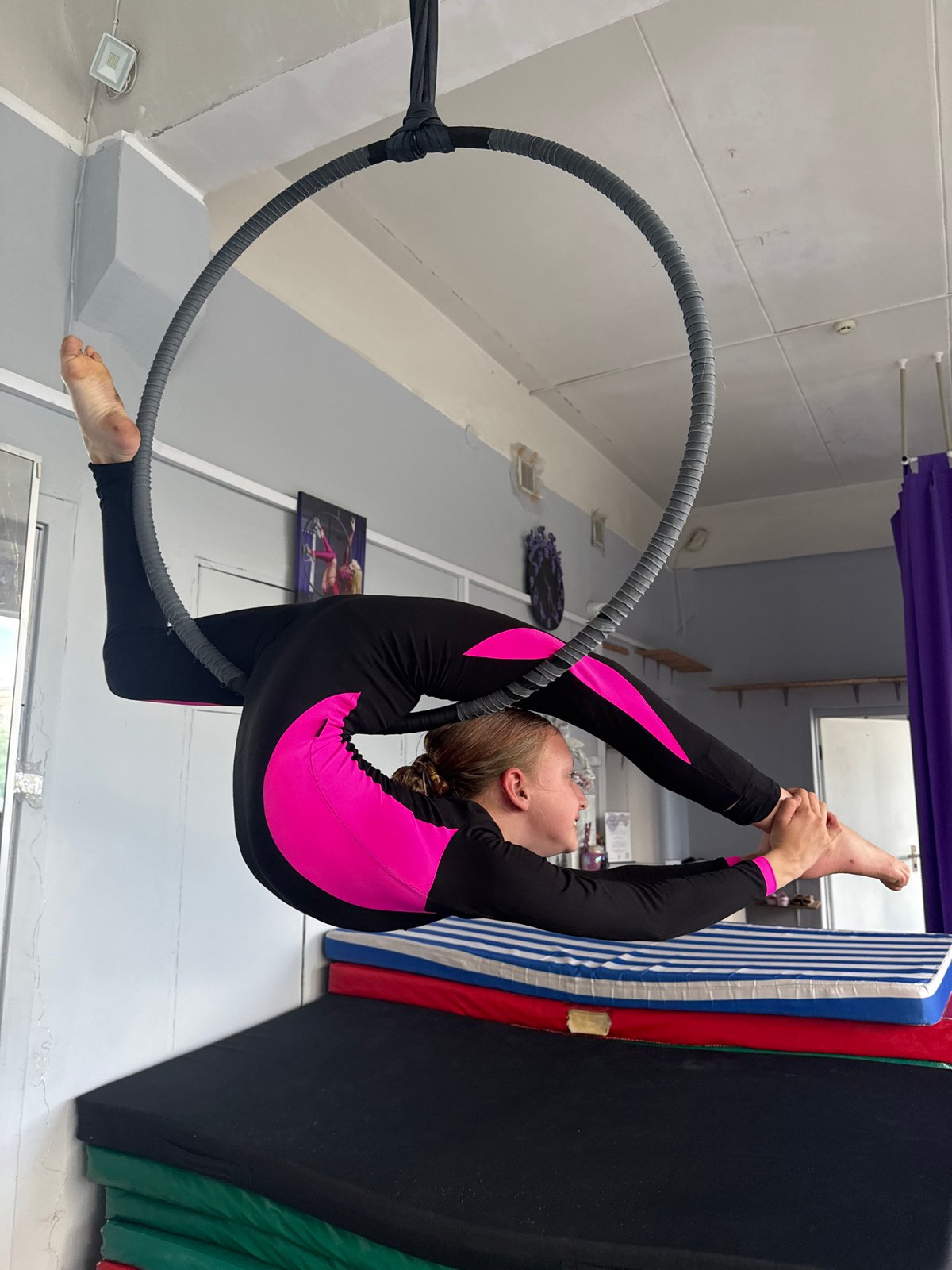 Young gymnast trains on aerial hoop in Dnipro studio