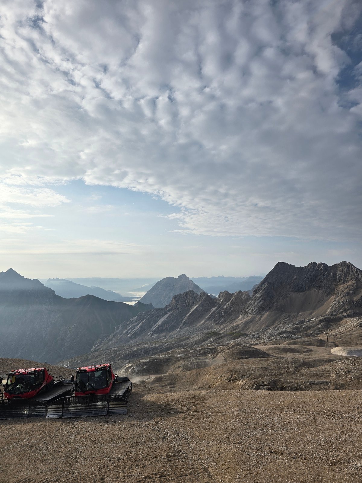Snowcats and misty alpine peaks above Garmisch-Partenkirchen