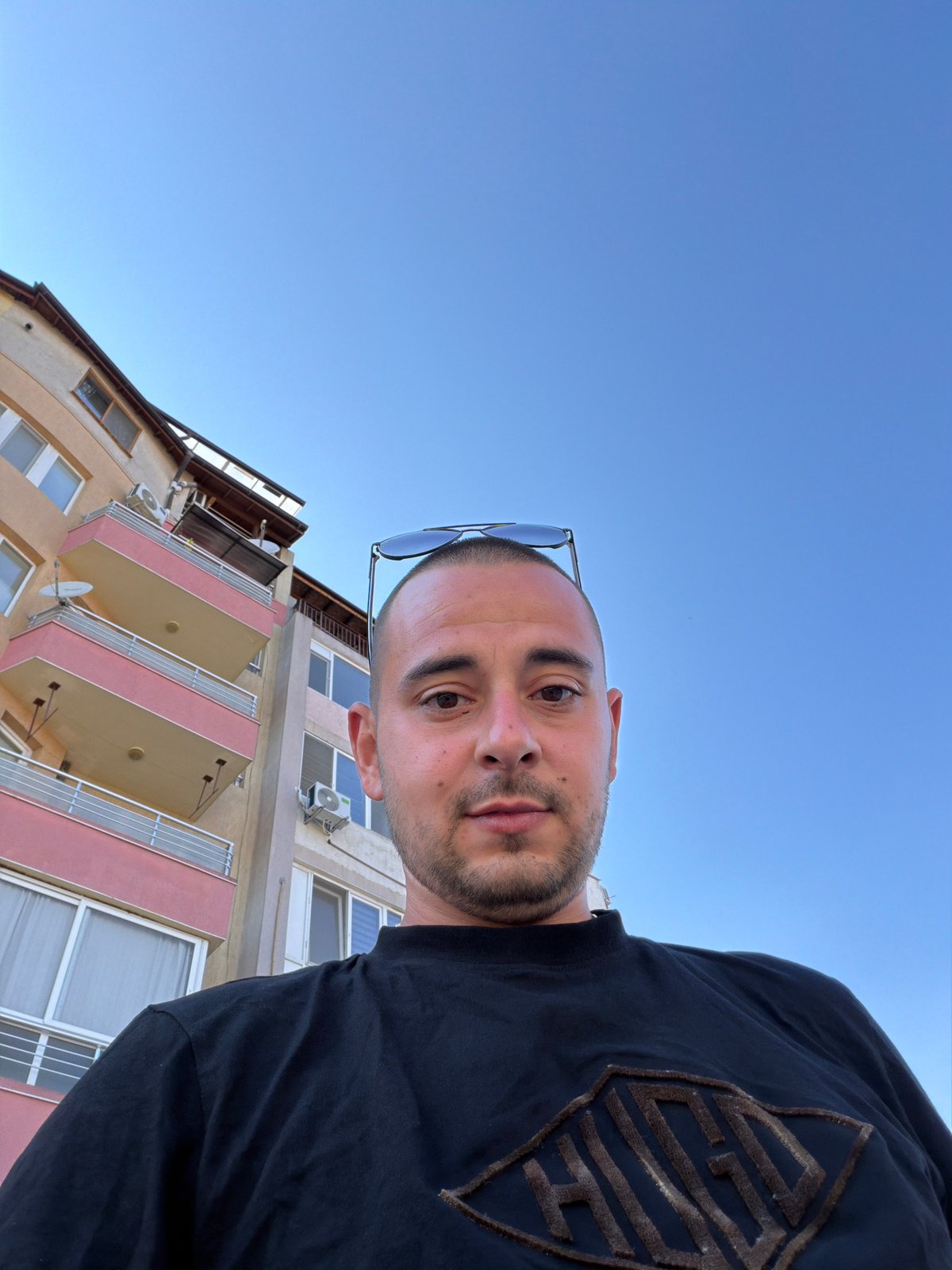 Casual photos outside a Burgas apartment block, mid-afternoon