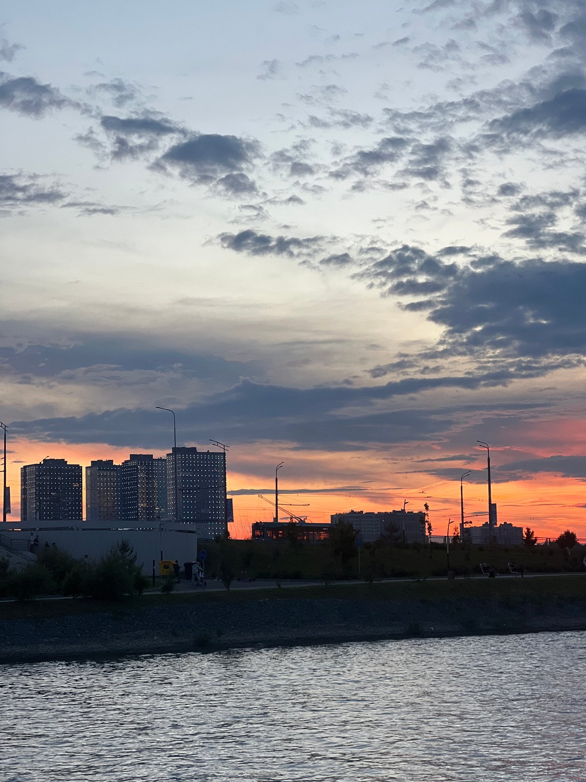 Sunset observed over Kazan waterfront with city skyline visible