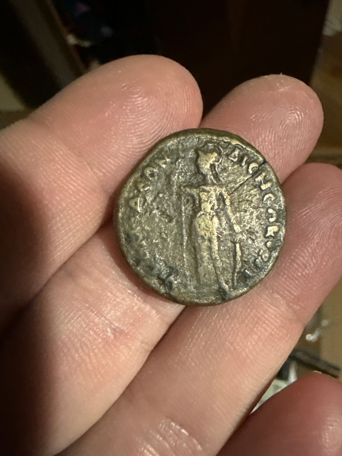 Person examines coin and decorative Nokia phone in Bulgaria