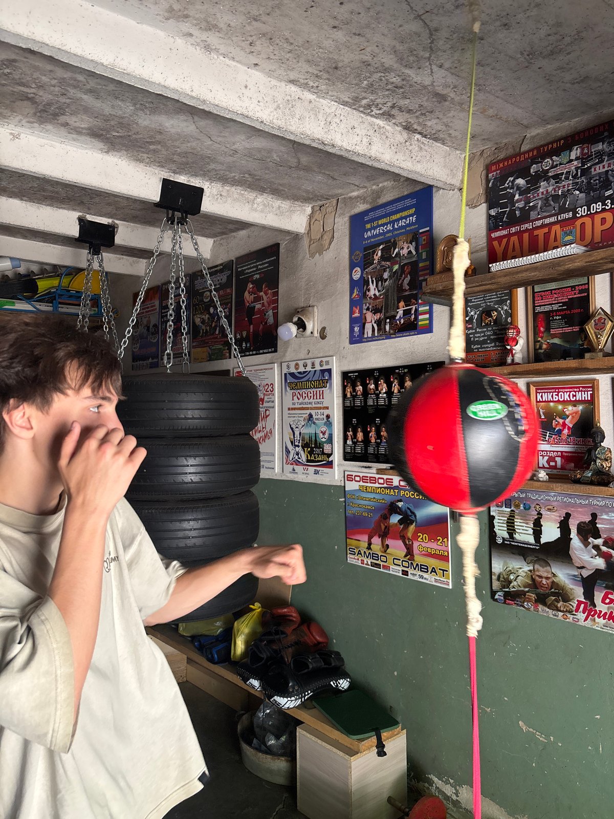 Boxing training session observed in basement gym in Chaikovsky
