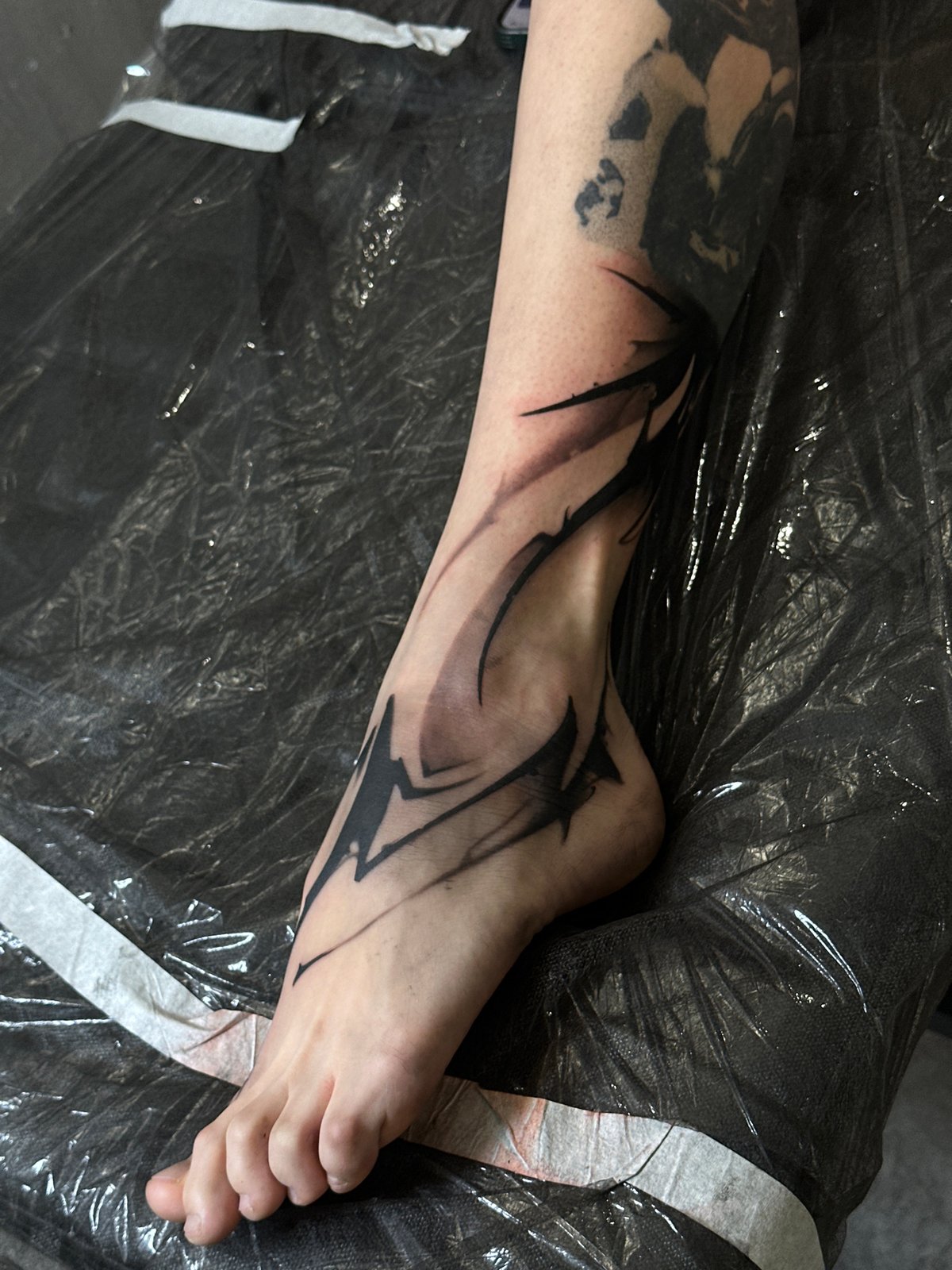 Fresh blackwork tattoo captured at Moscow studio