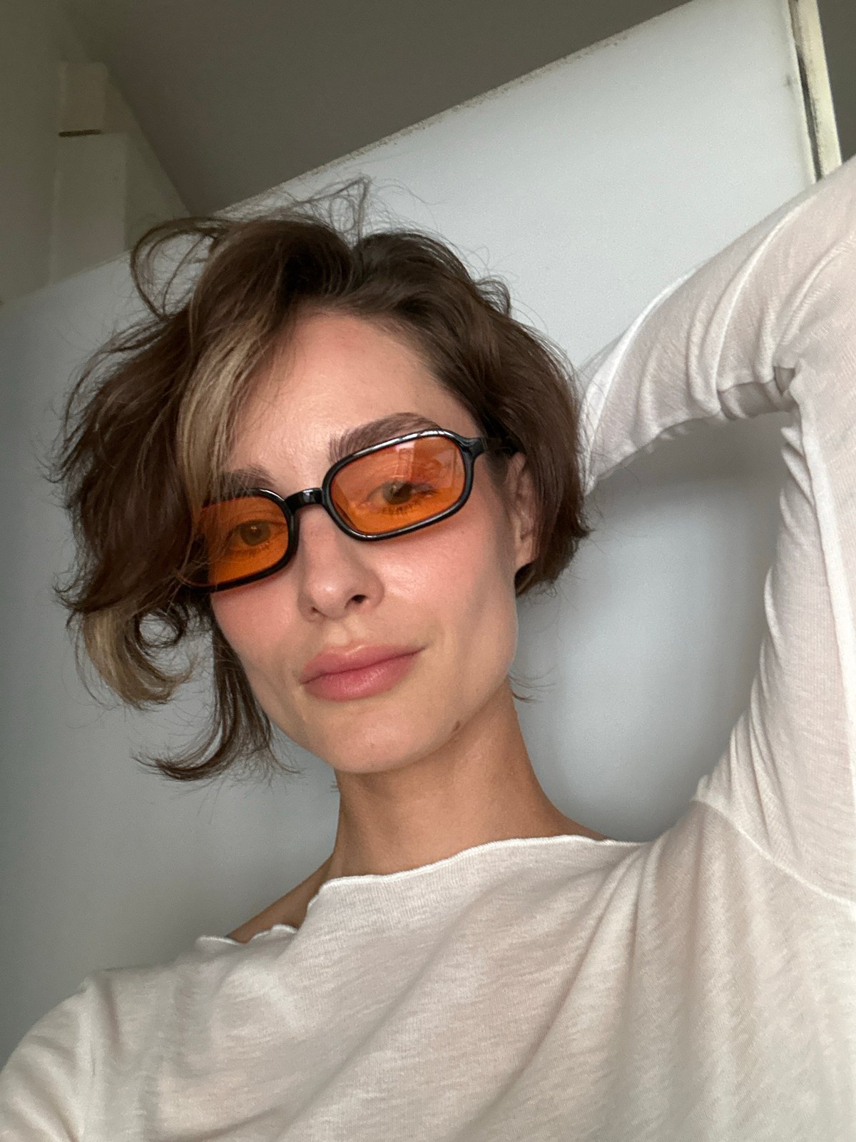 Woman takes selfie session in orange glasses, Kiel