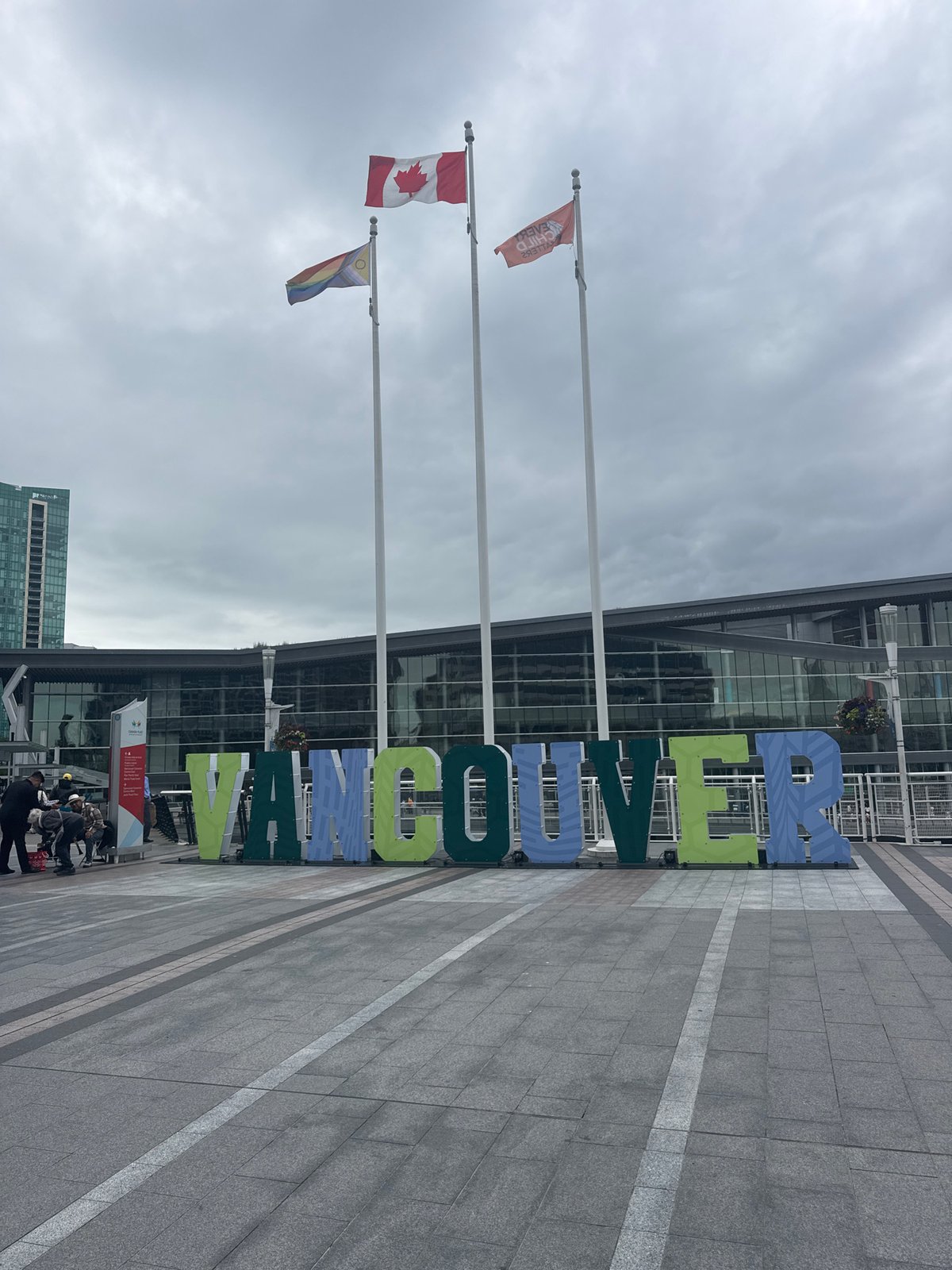 Canada Place waterfront buzzing on a cloudy Vancouver afternoon