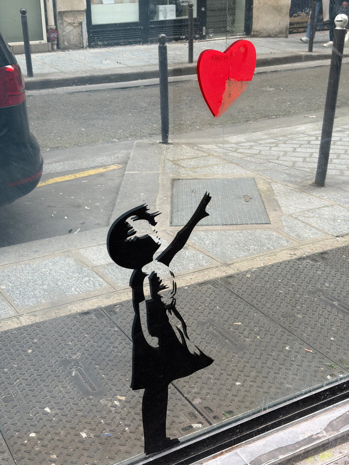 Banksy-style heart artwork spotted in Paris window display