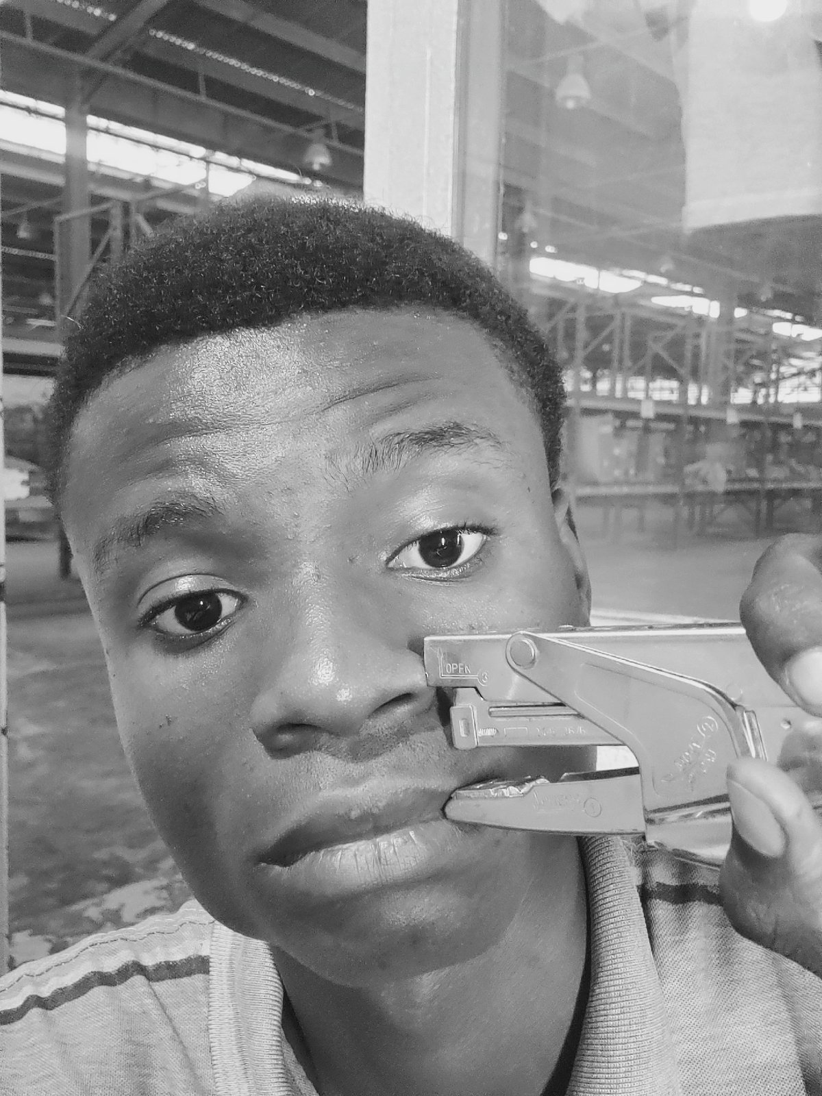 Portrait session captures young man with office supplies in Nigeria