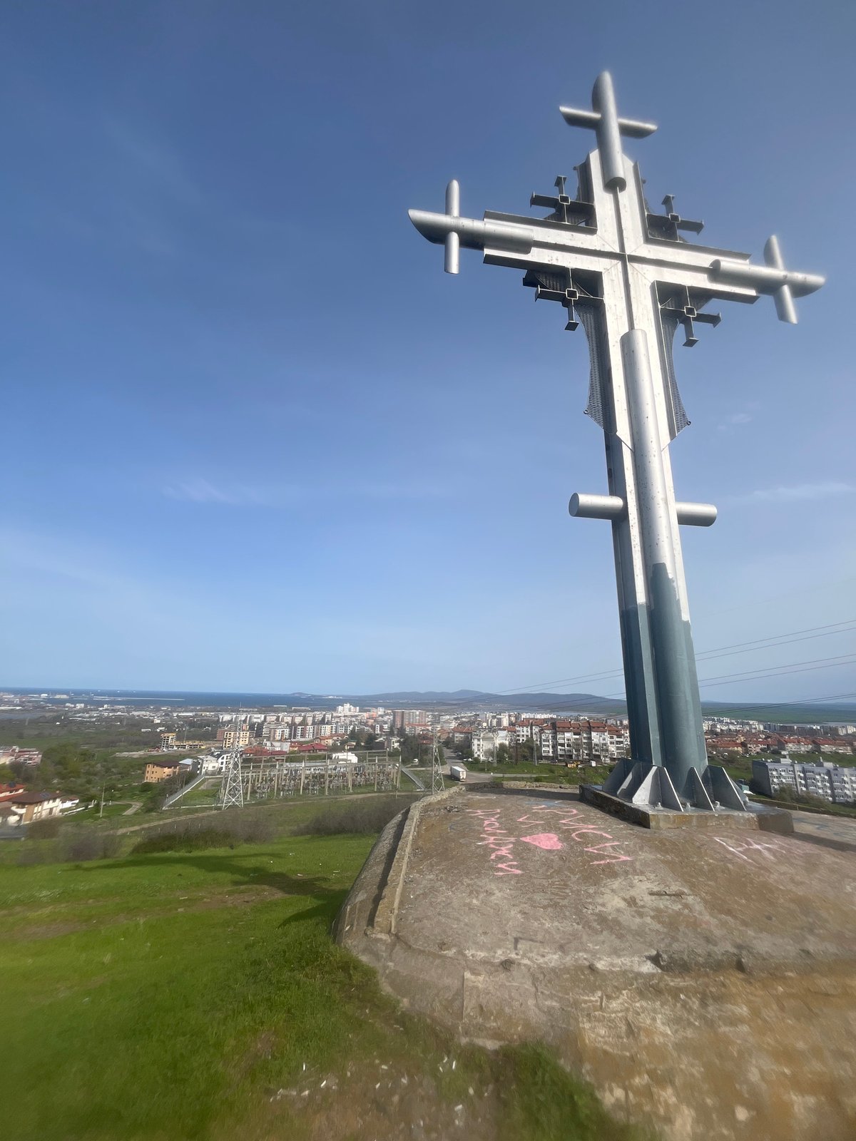 Burgas cityscape documented featuring prominent cross and hillside views