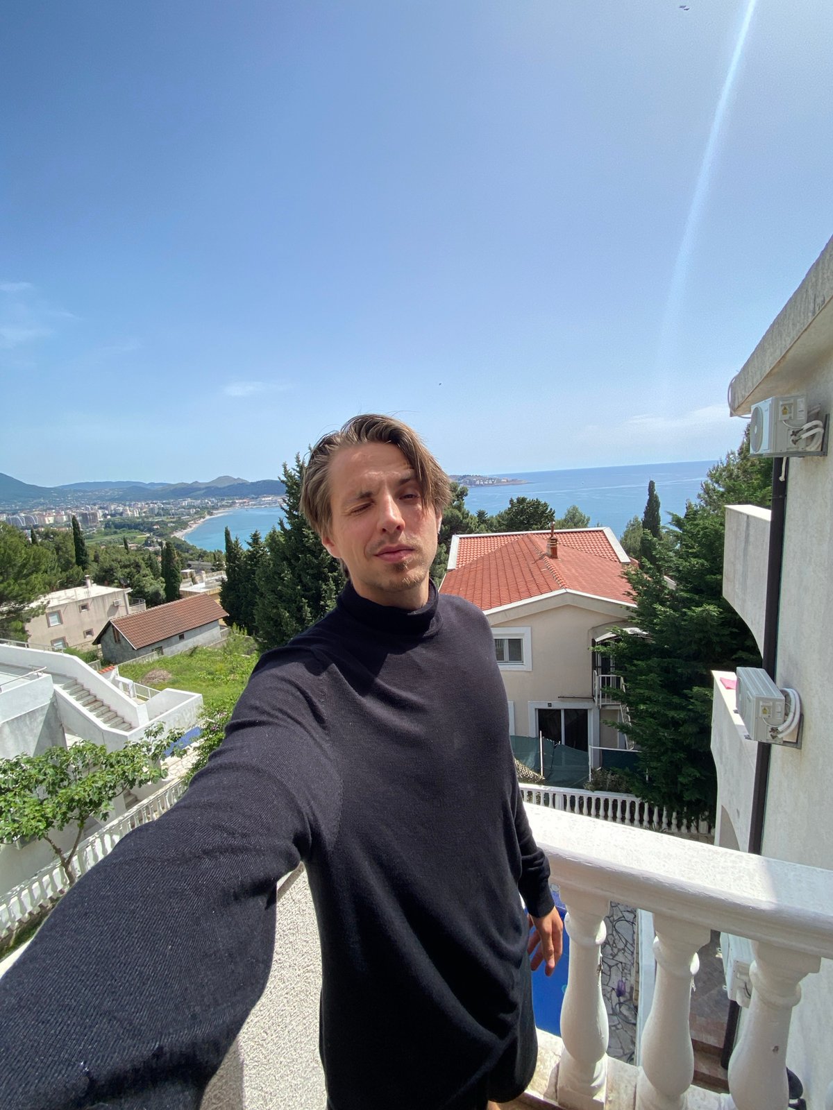 Tourist captures selfie overlooking Šušanj coastline in Montenegro