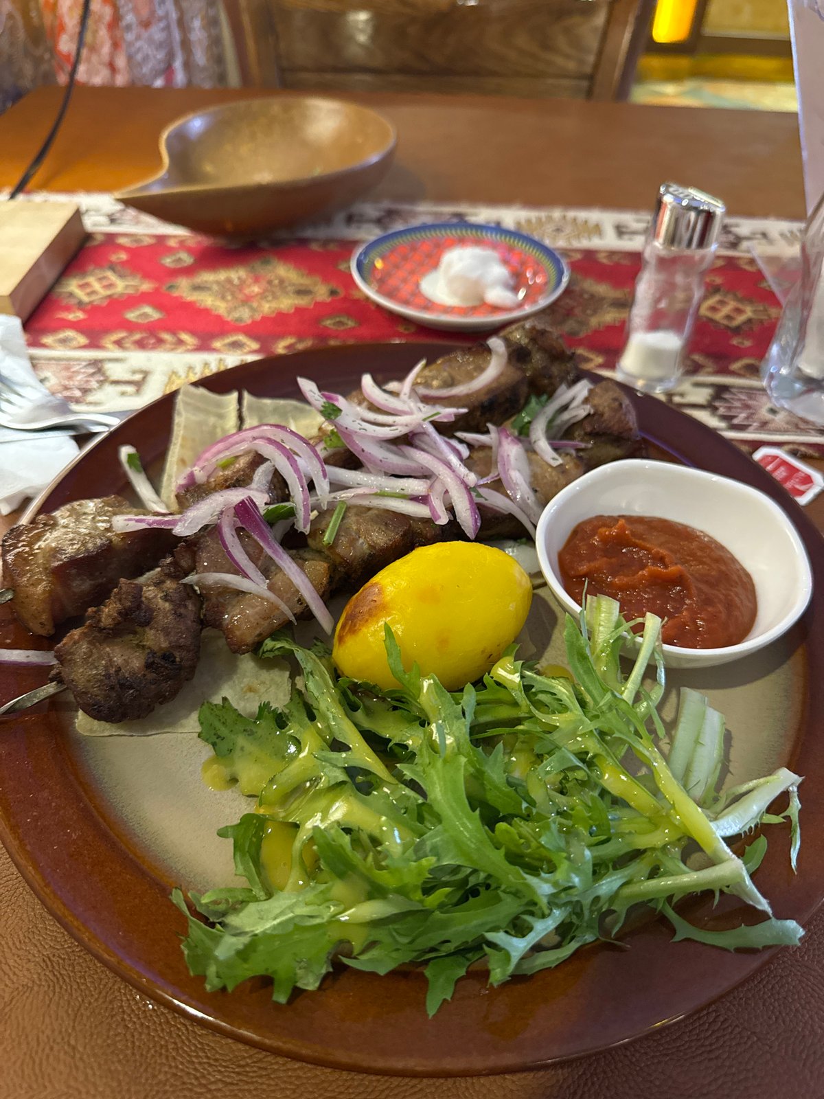 Restaurant meal documented in Ulaanbaatar featuring grilled meat skewers