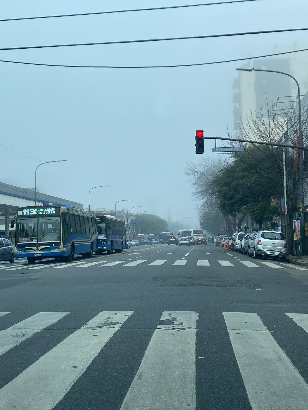 Buses halt on foggy Buenos Aires street