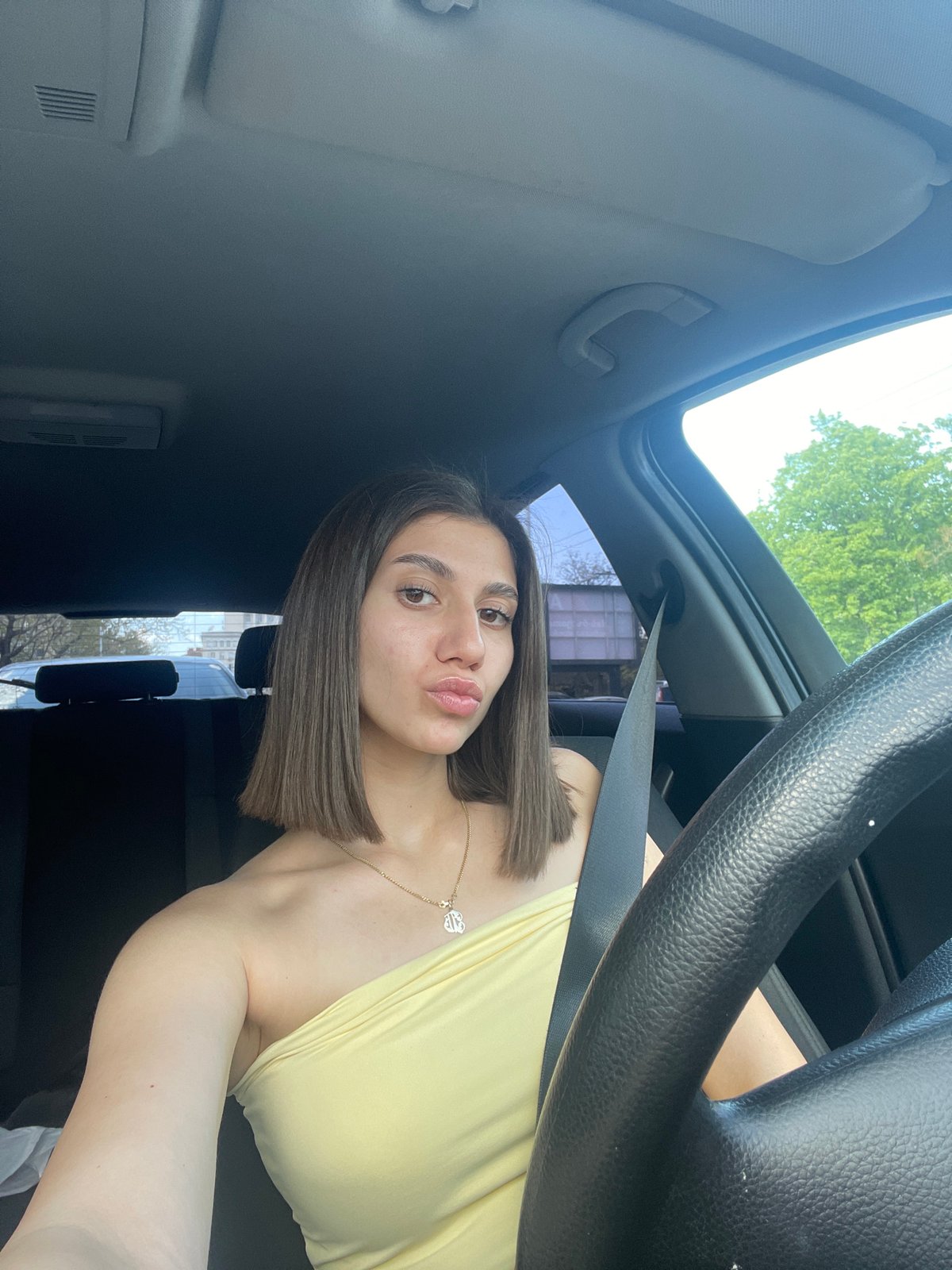 Woman takes playful car selfies in Sofia