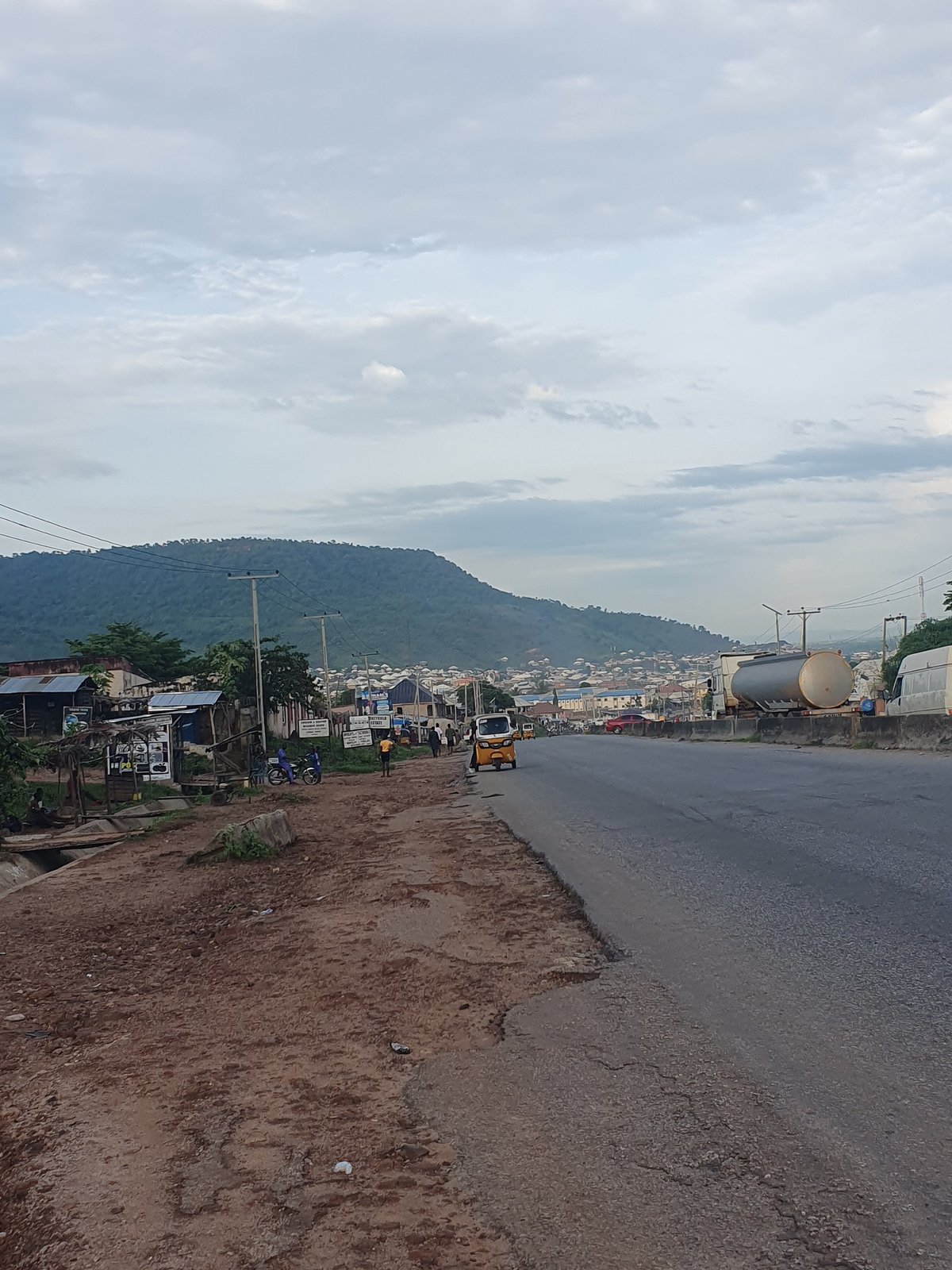 Daily street life and motorcycle traffic in Lokoja, Nigeria