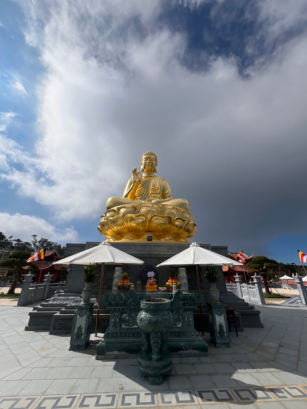Golden Buddha statue documented at Vietnamese temple complex