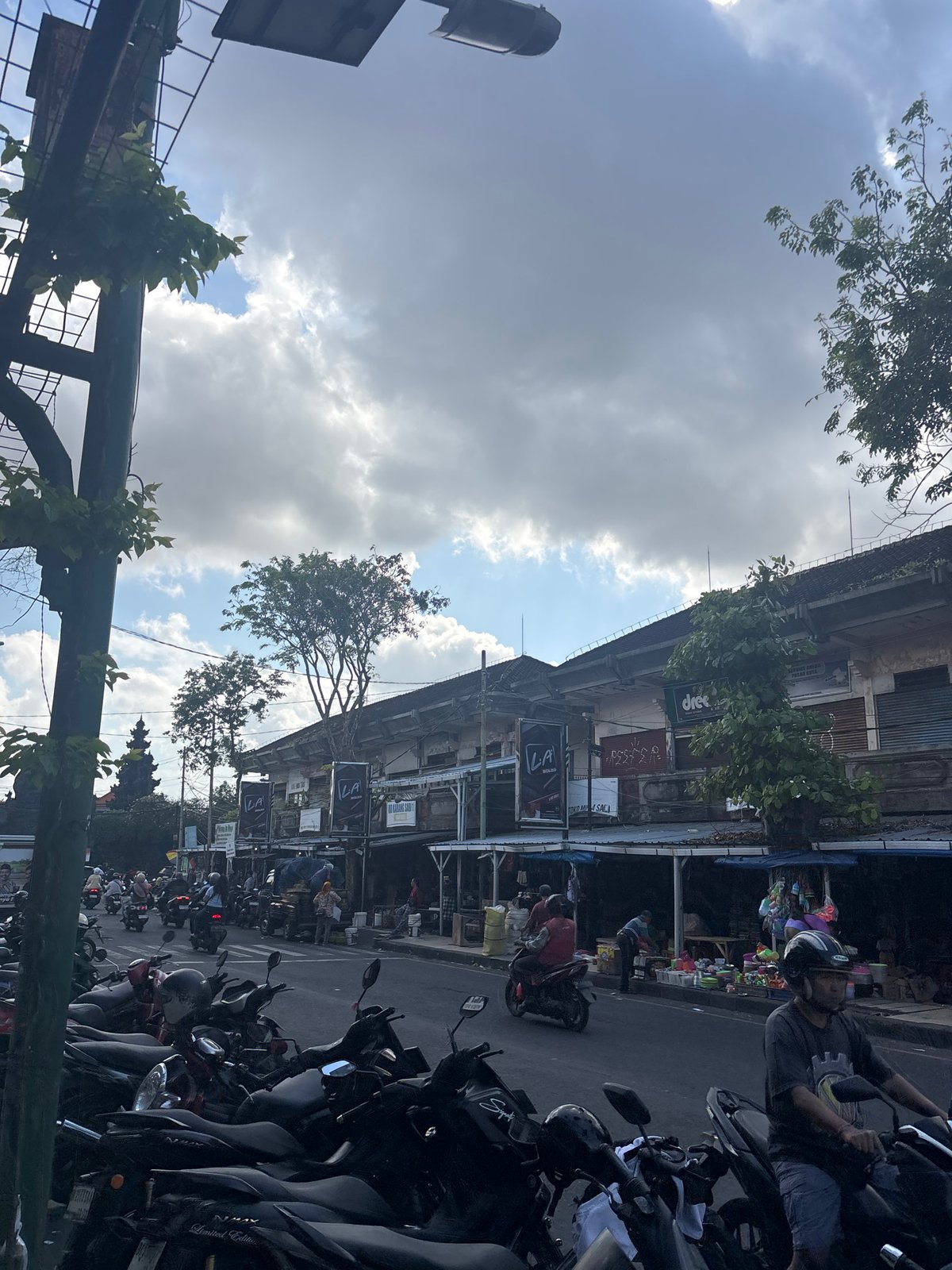 Street traffic and a fuel queue in Kuta, Bali