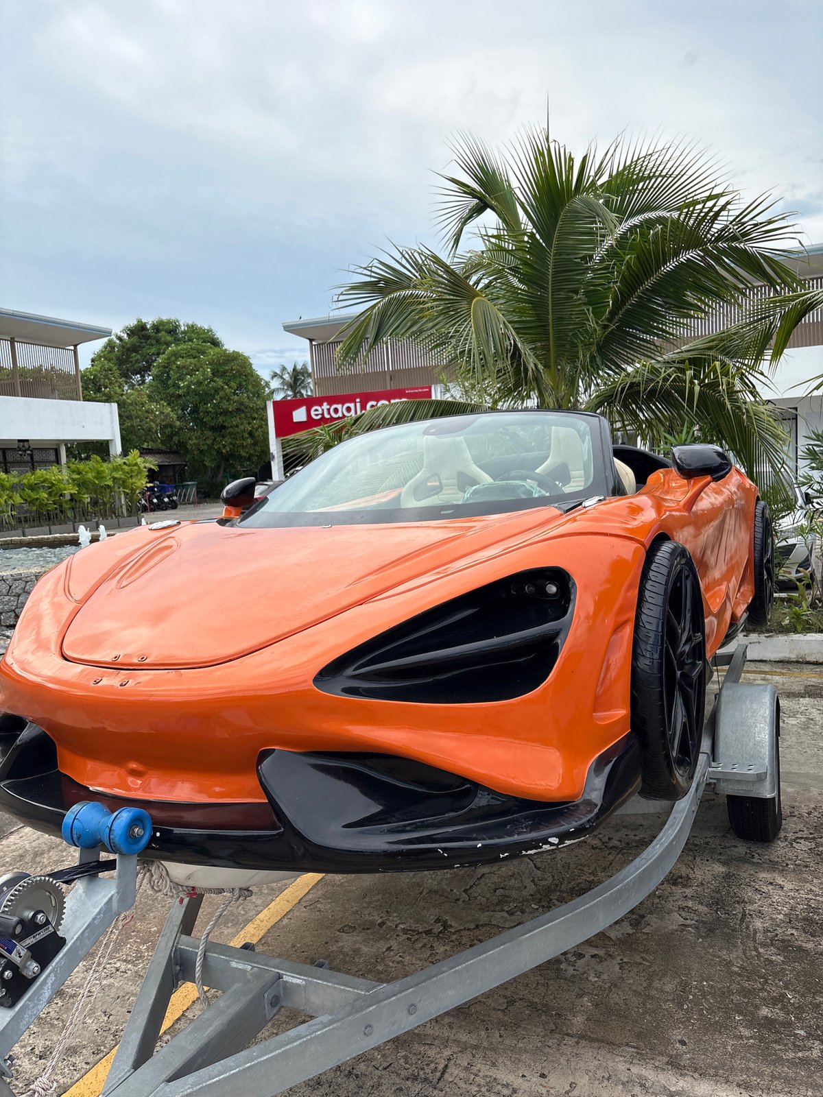 McLaren sports cars on trailers in Chalong, Thailand