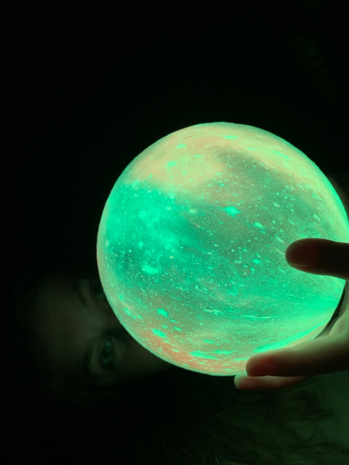 Person holds glowing orbs in nighttime Chaikovsky, Russia