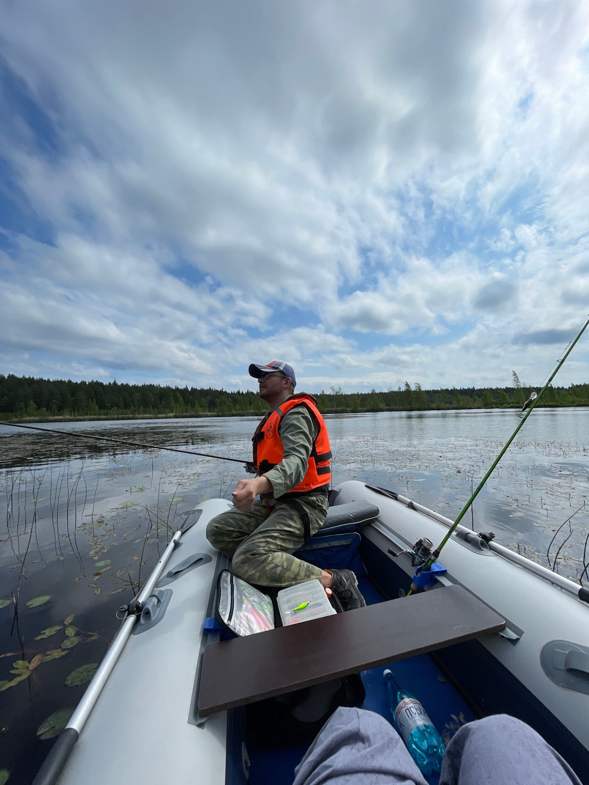 Morning fishing and water lilies observed on Russian lake