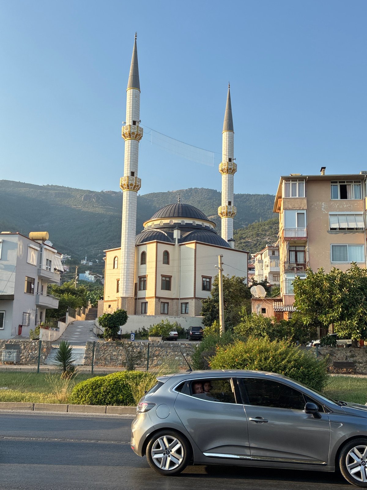 Sunny afternoon street scene near a mosque in Alanya