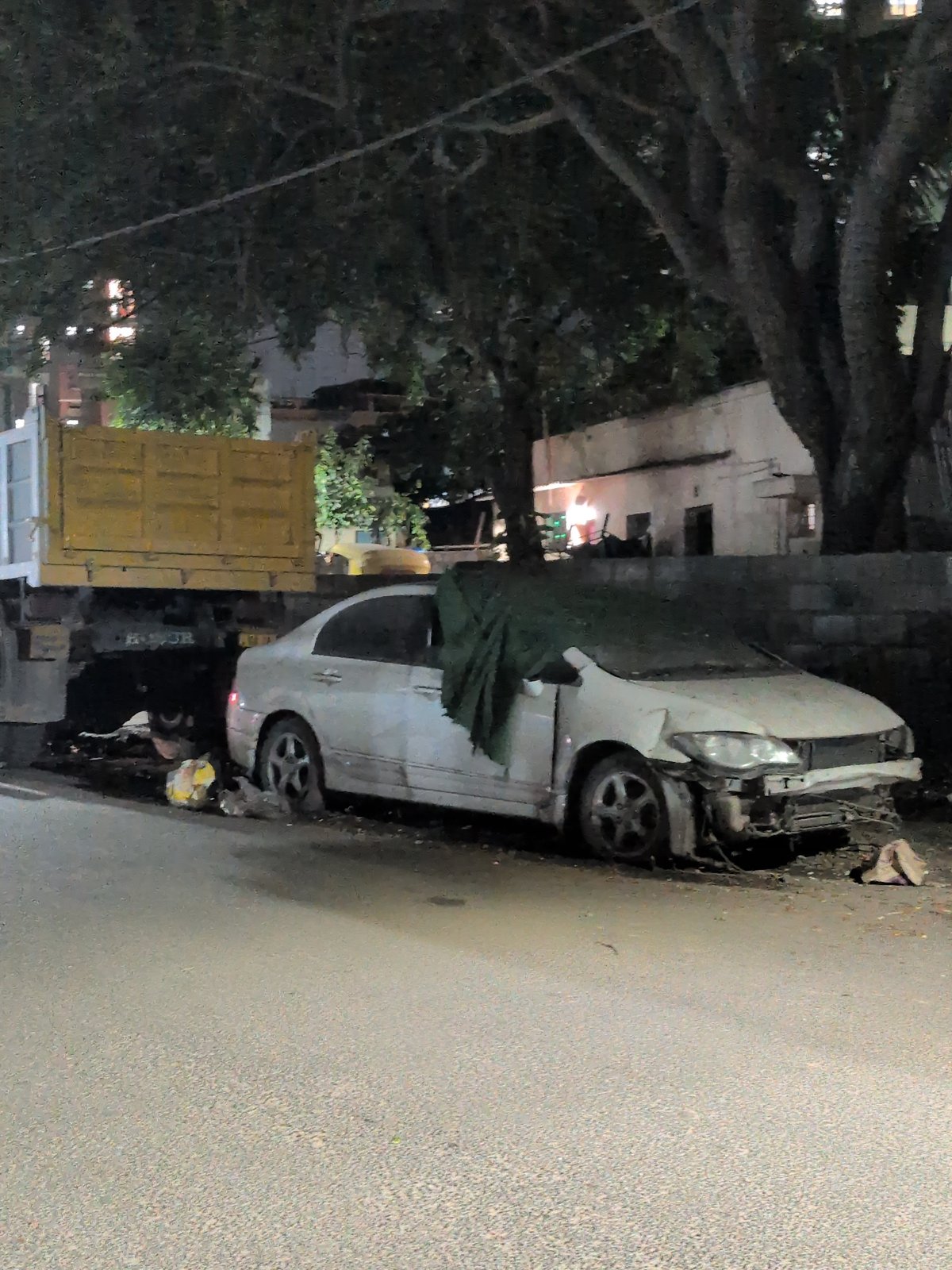 Bengaluru nighttime fireworks celebration mixed with everyday street life